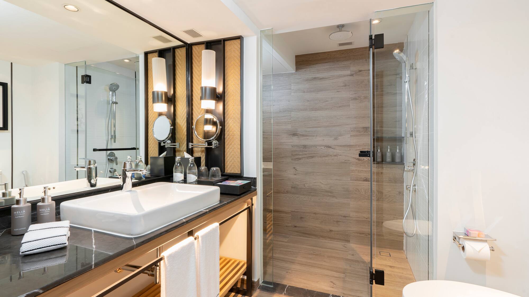 a bathroom with a shower and sink