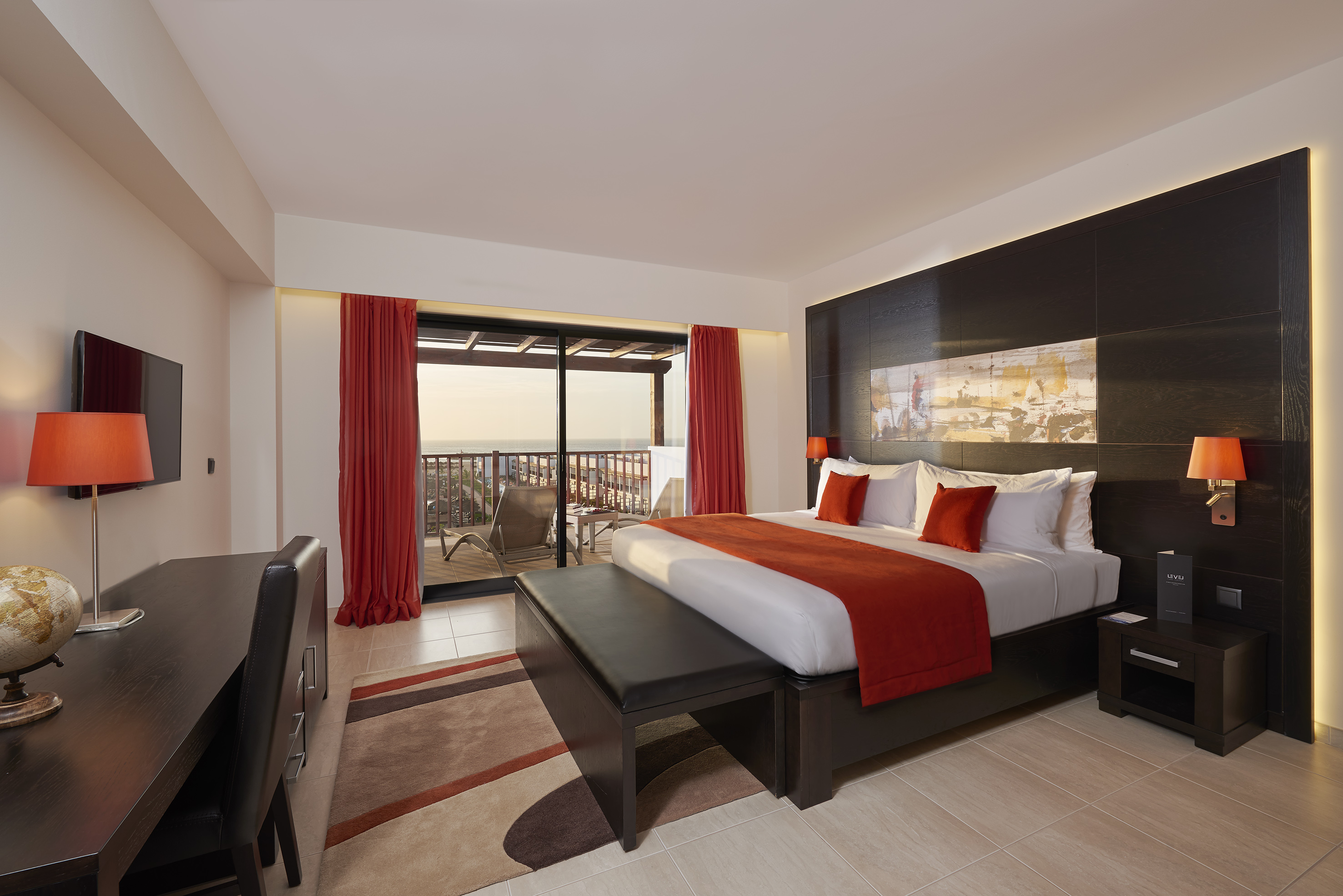 a bedroom with a bed and a table