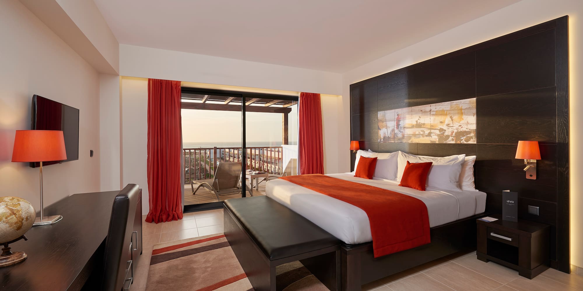 a bedroom with a bed and a table