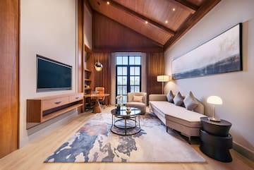 a living room with a couch and a tv