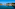 a body of water with boats and buildings on the side
