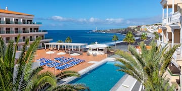 a swimming pool next to a beach