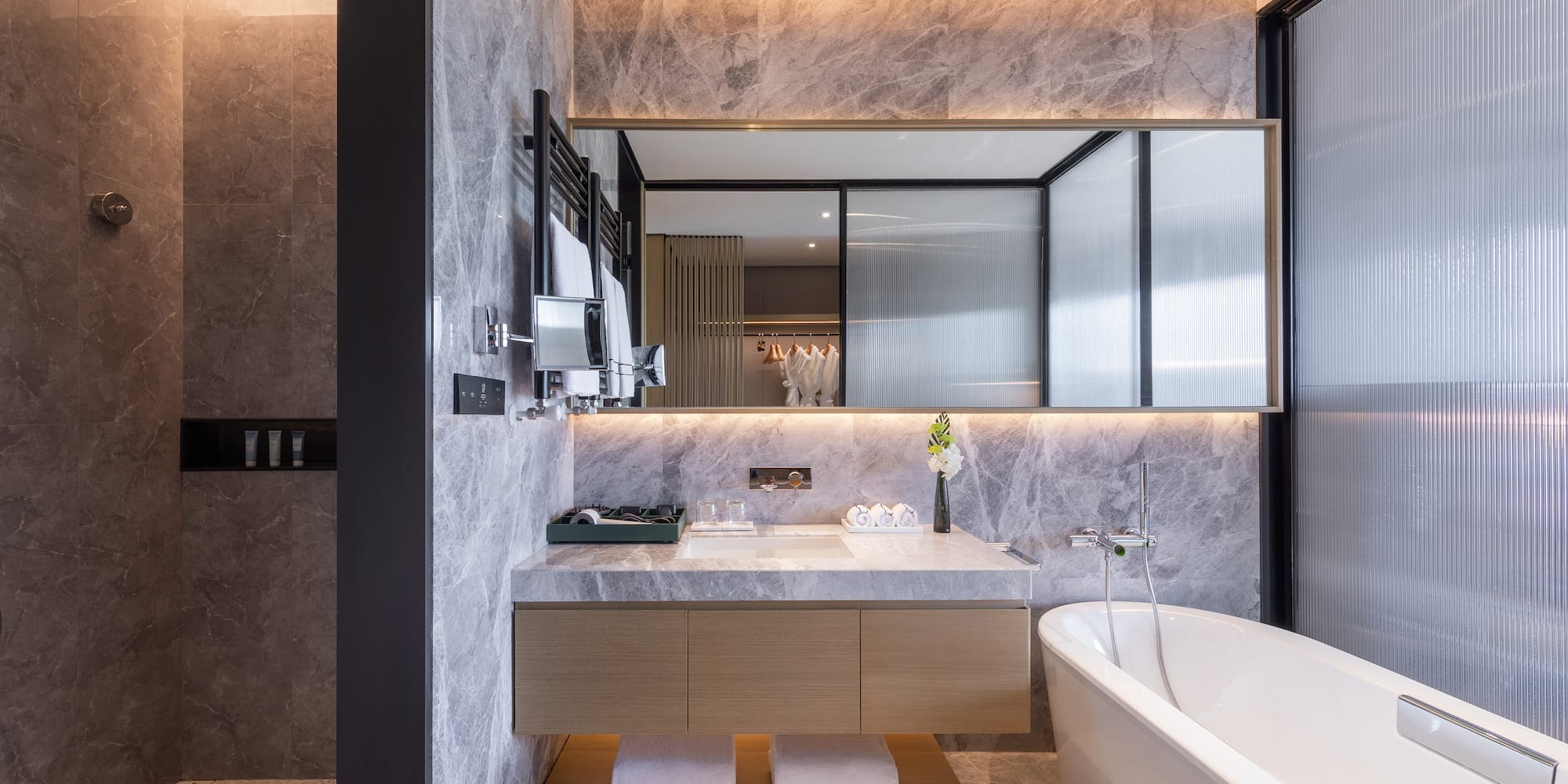 a bathroom with a bathtub and a sink