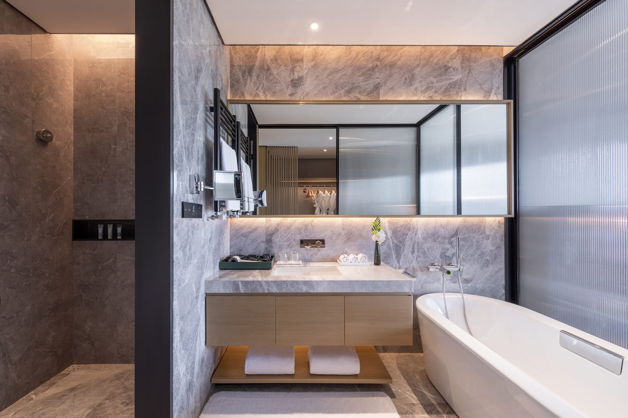 a bathroom with a bathtub and a sink