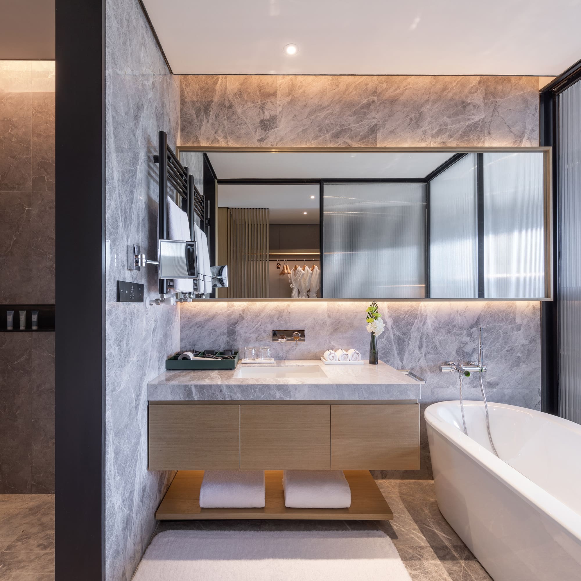 a bathroom with a bathtub and a sink