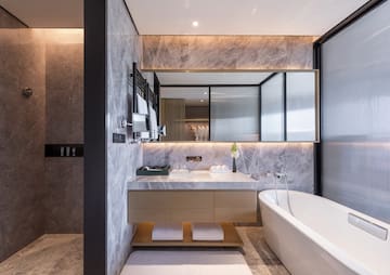 a bathroom with a bathtub and a sink