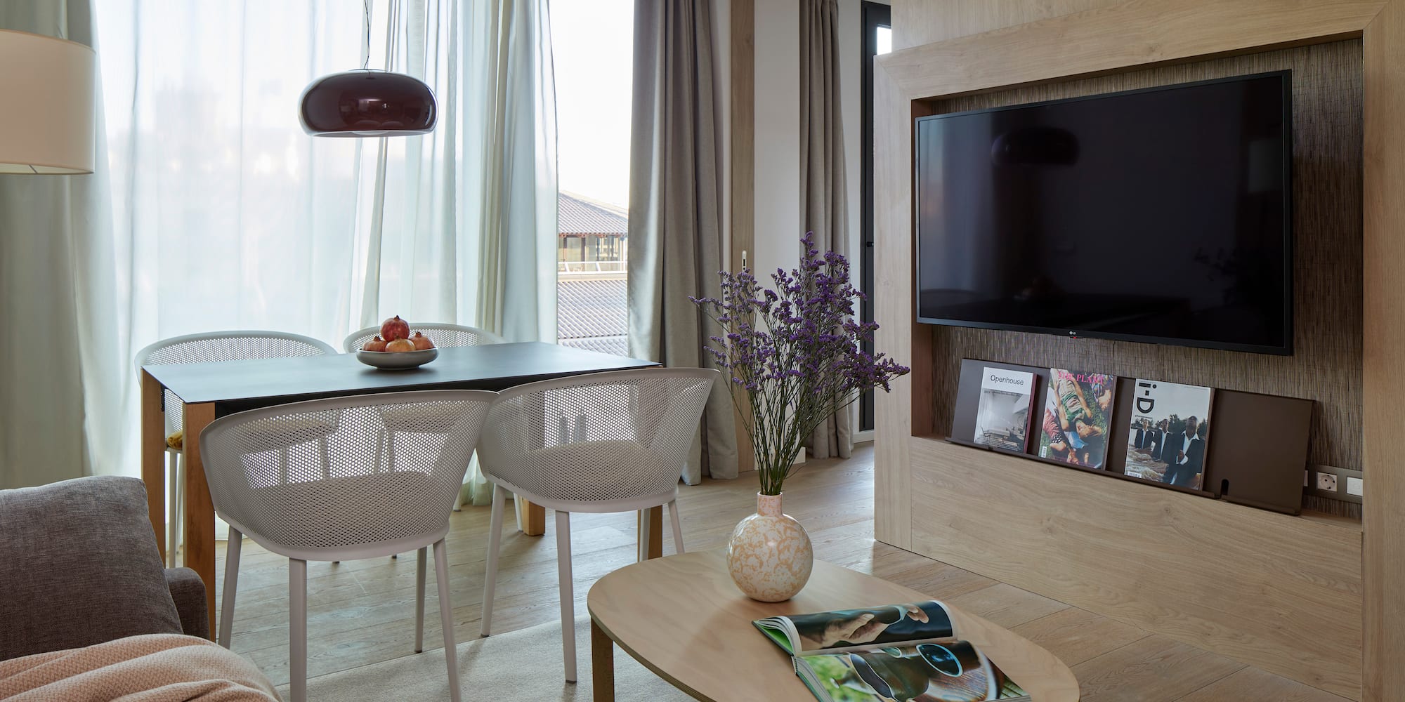 a living room with a tv and table
