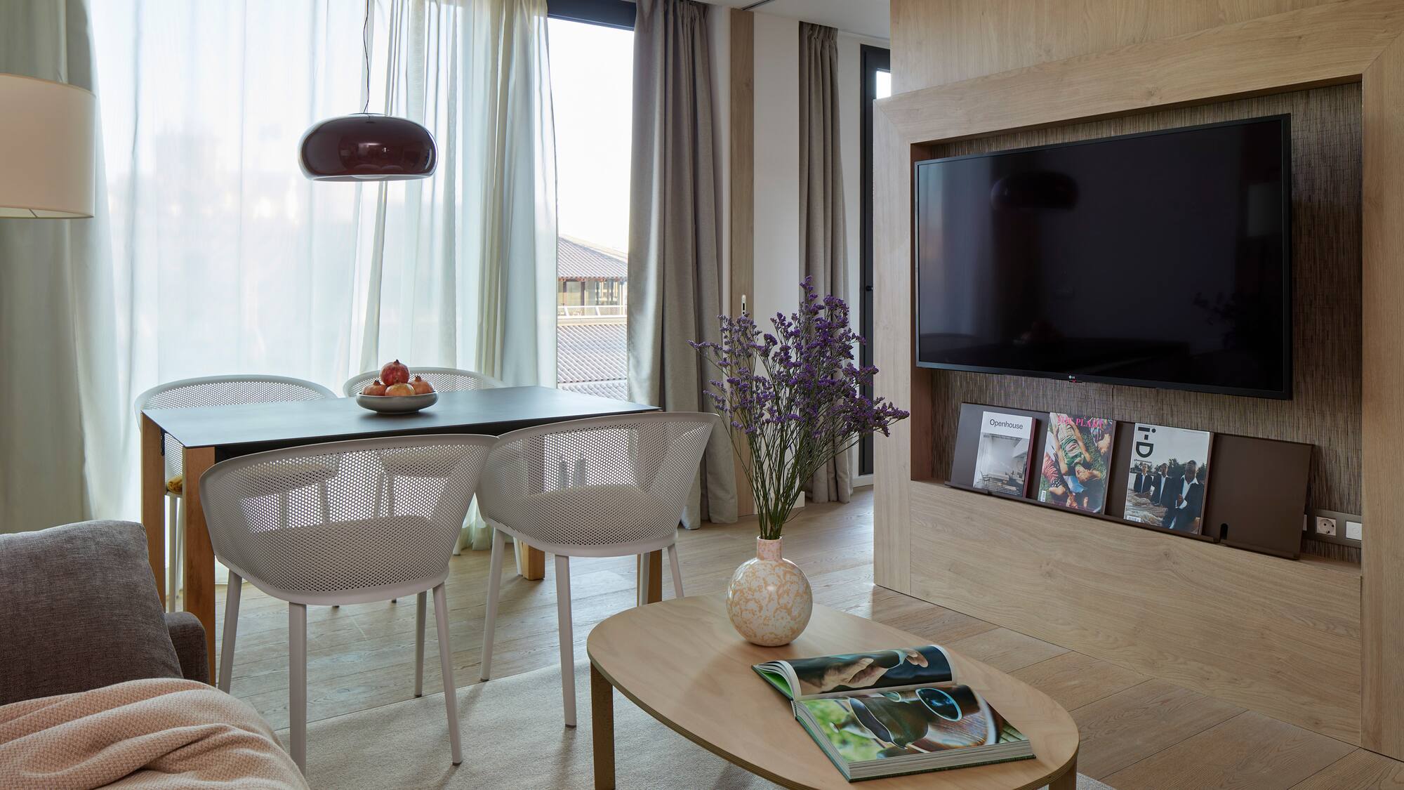 a living room with a tv and table