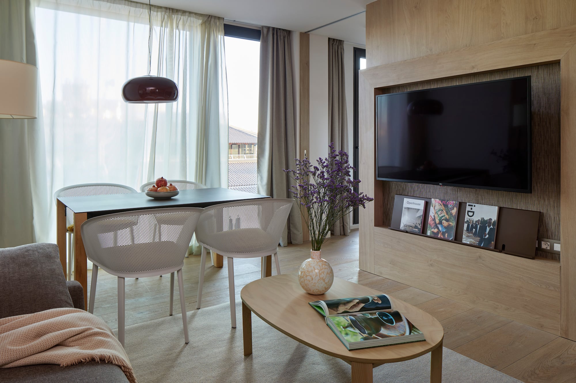 a living room with a tv and table