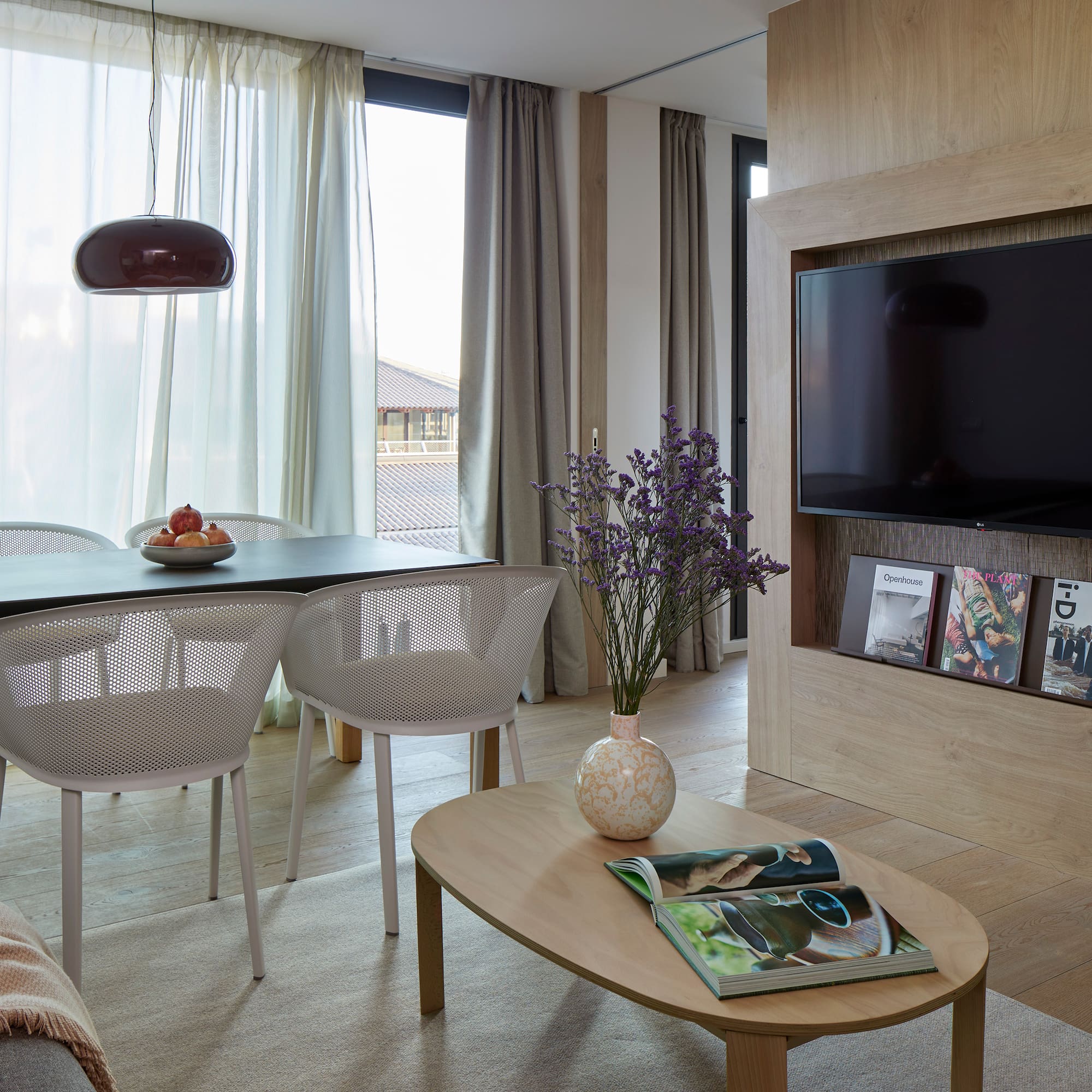 a living room with a tv and table