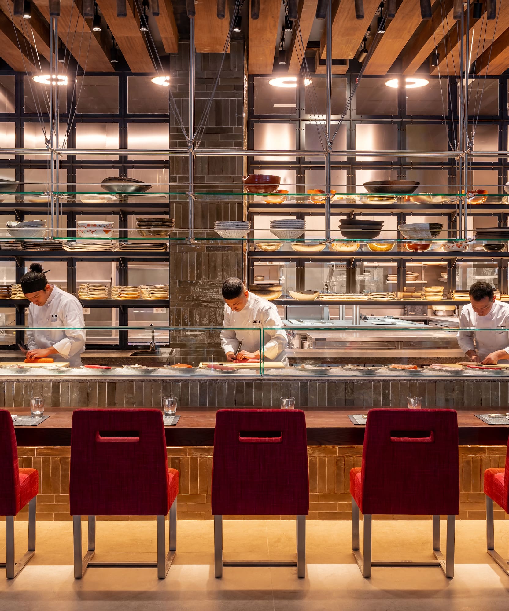 a group of people cooking in a restaurant