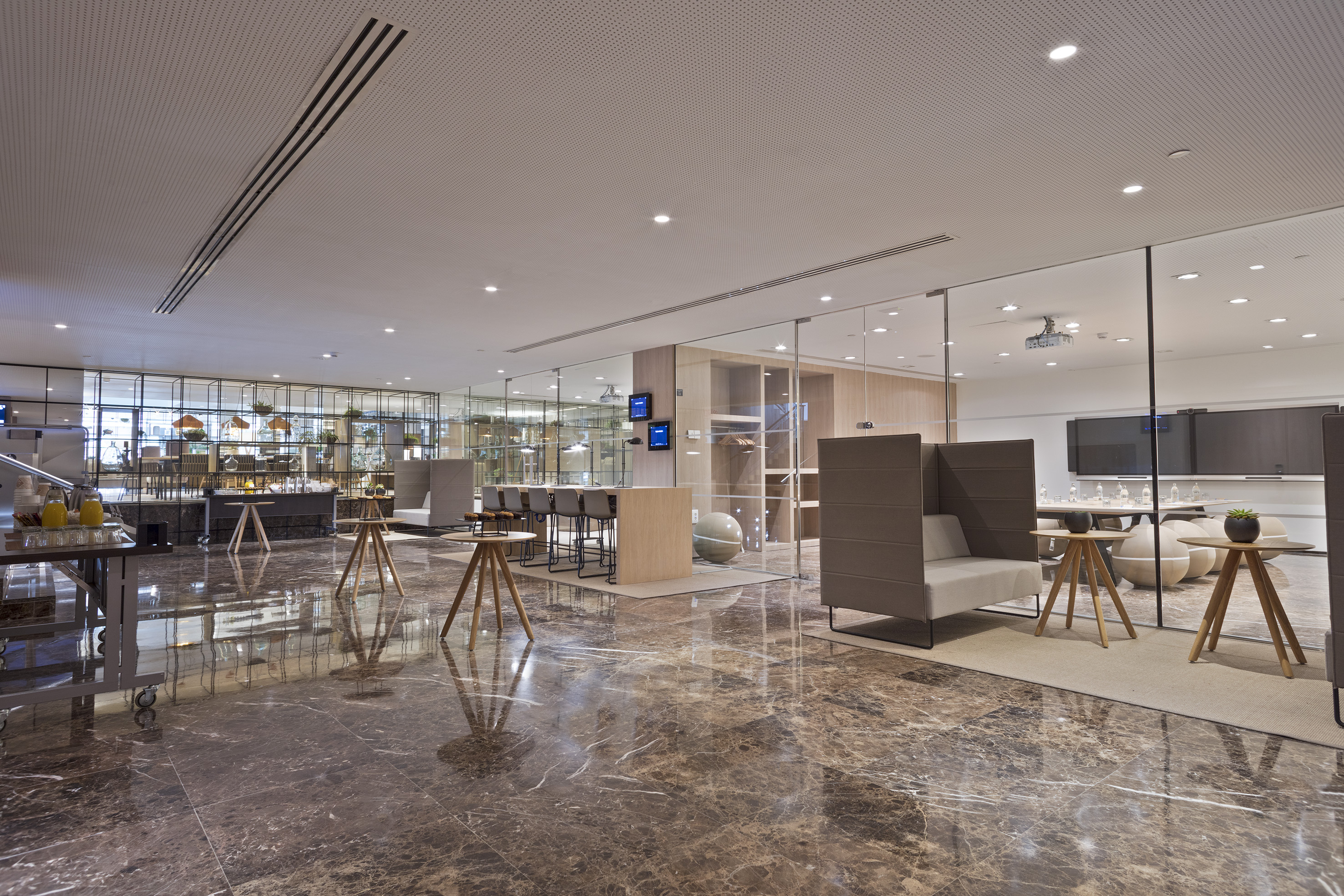 a room with glass walls and a large table