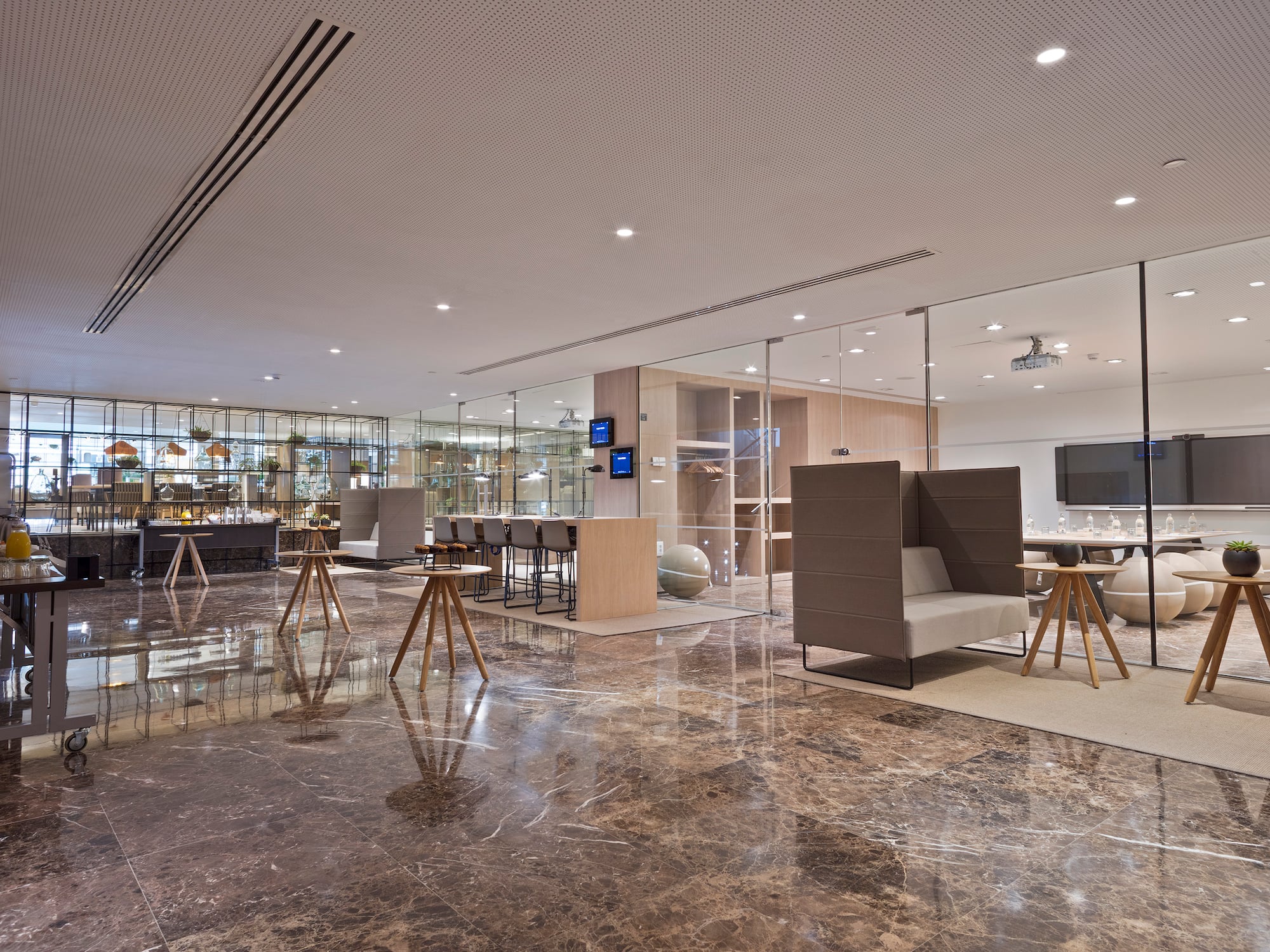 a room with glass walls and a large table