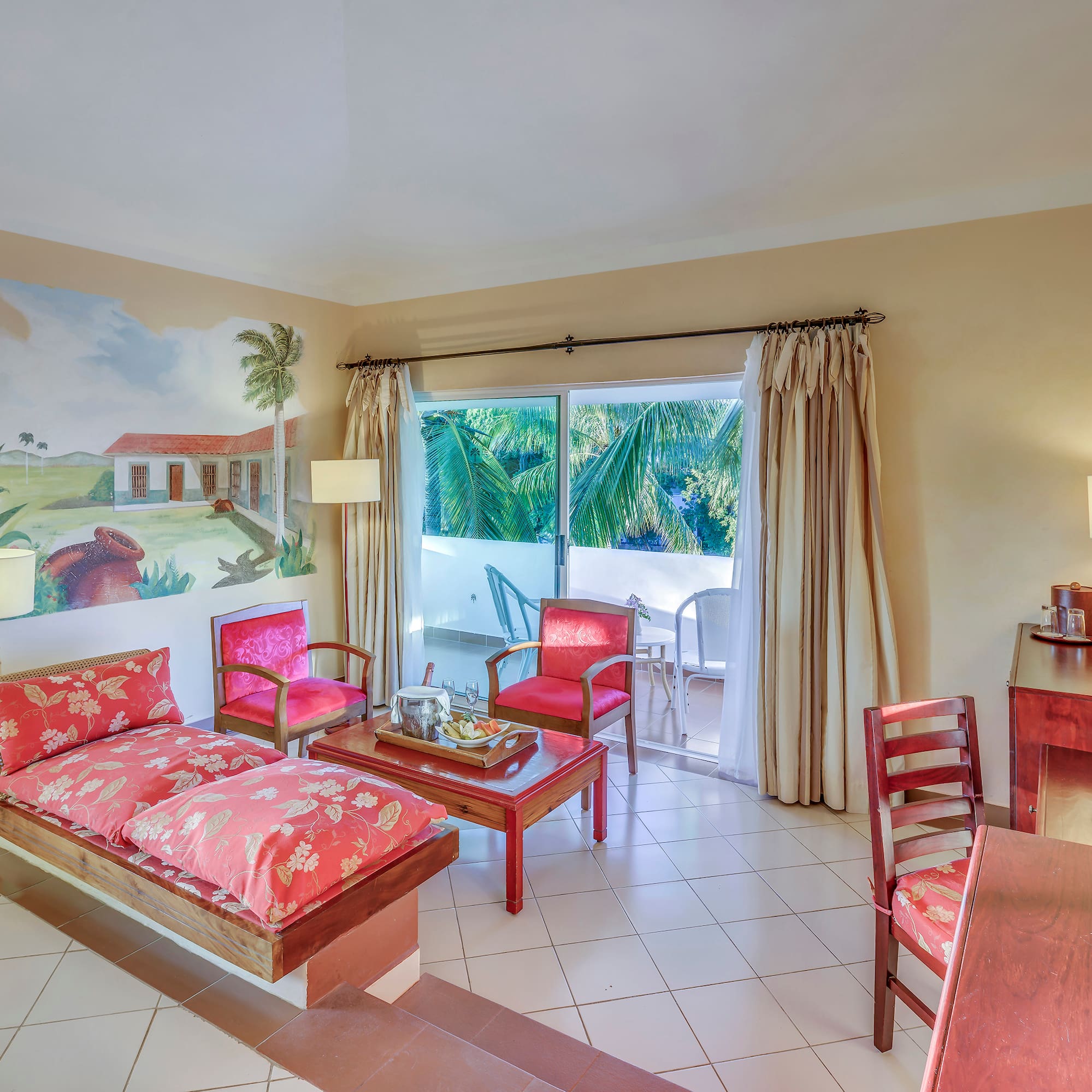 a room with a couch and chairs