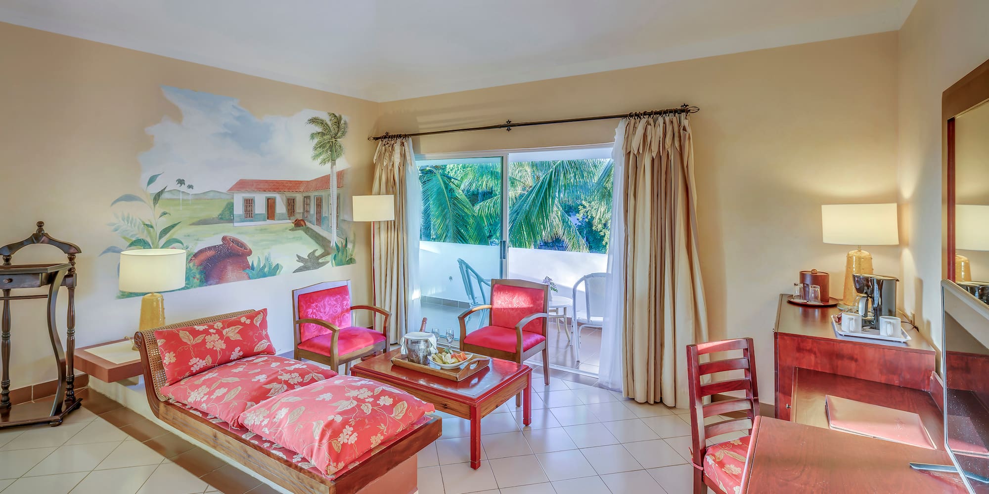 a room with a couch and chairs