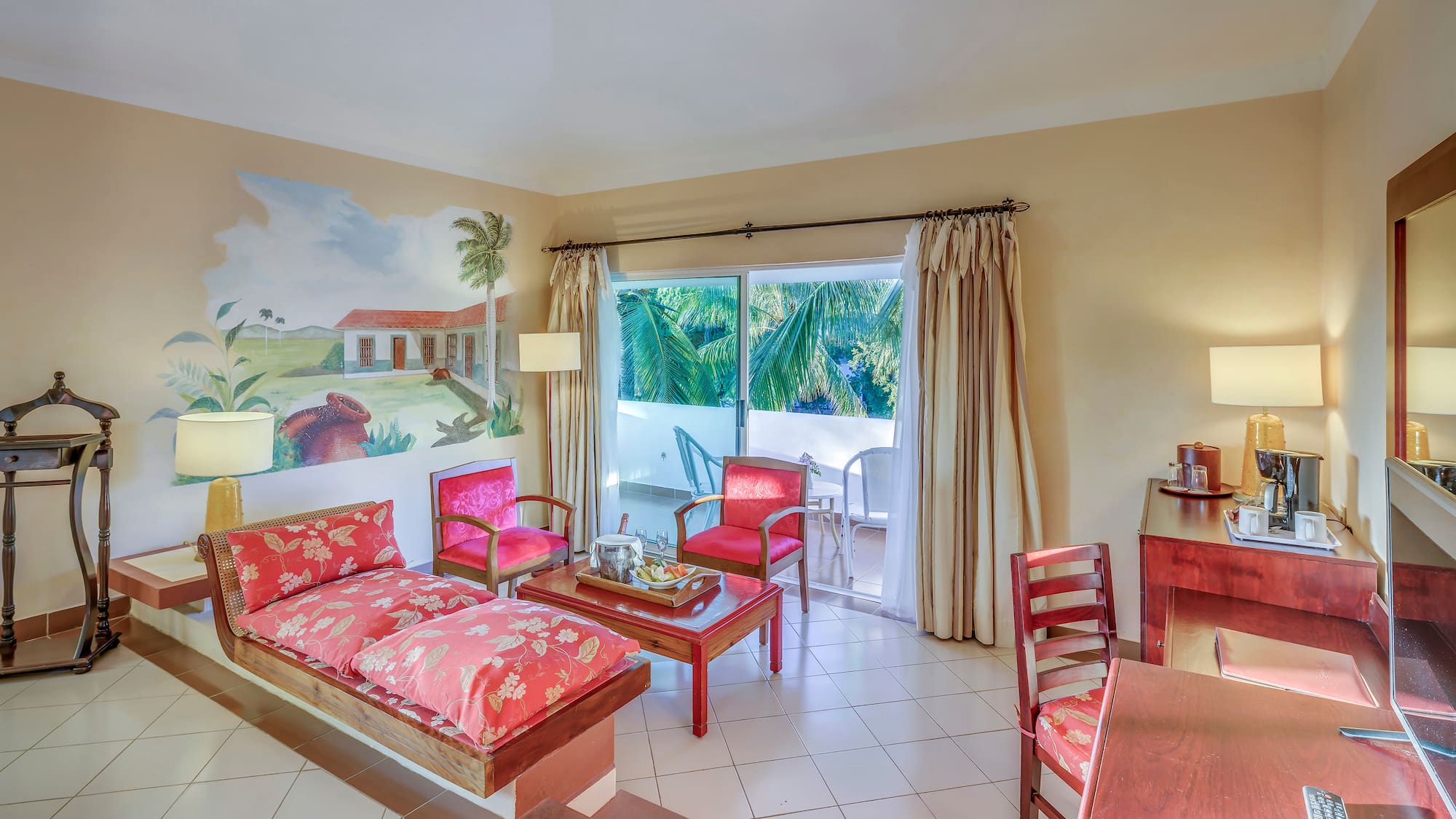 a room with a couch and chairs