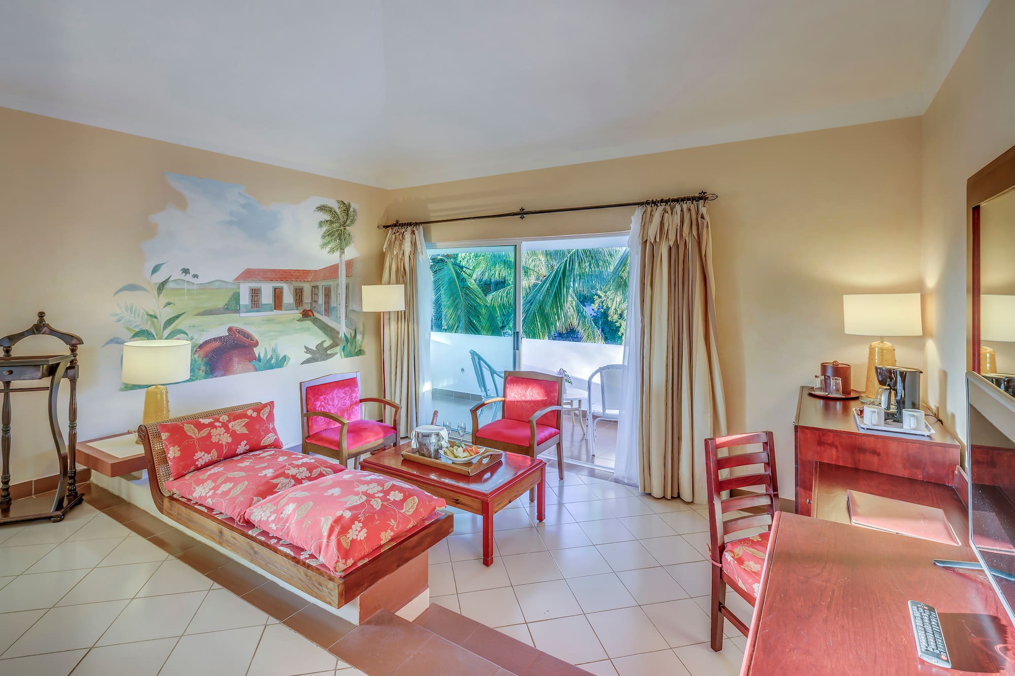 a room with a couch and chairs