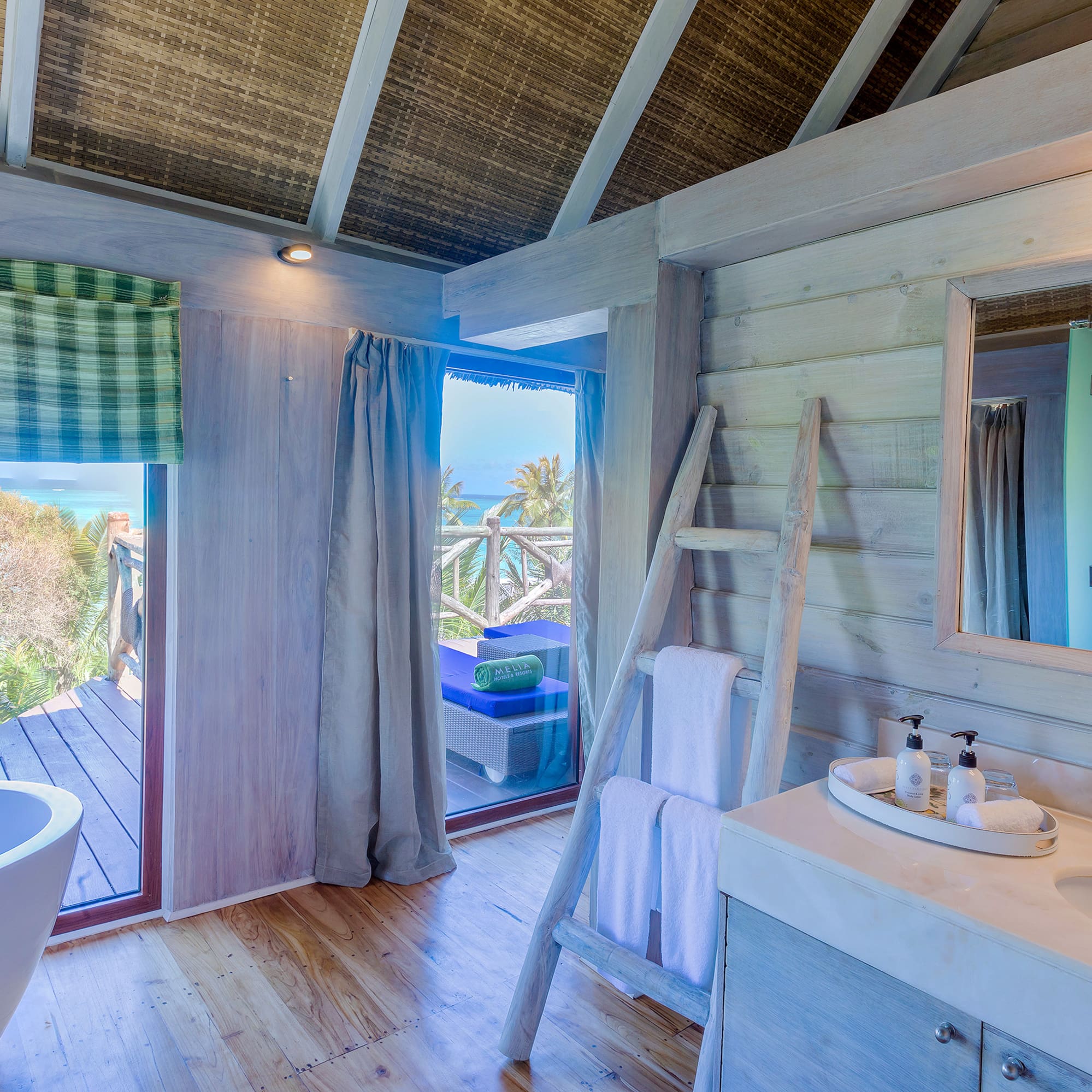 a bathroom with a tub and a sink