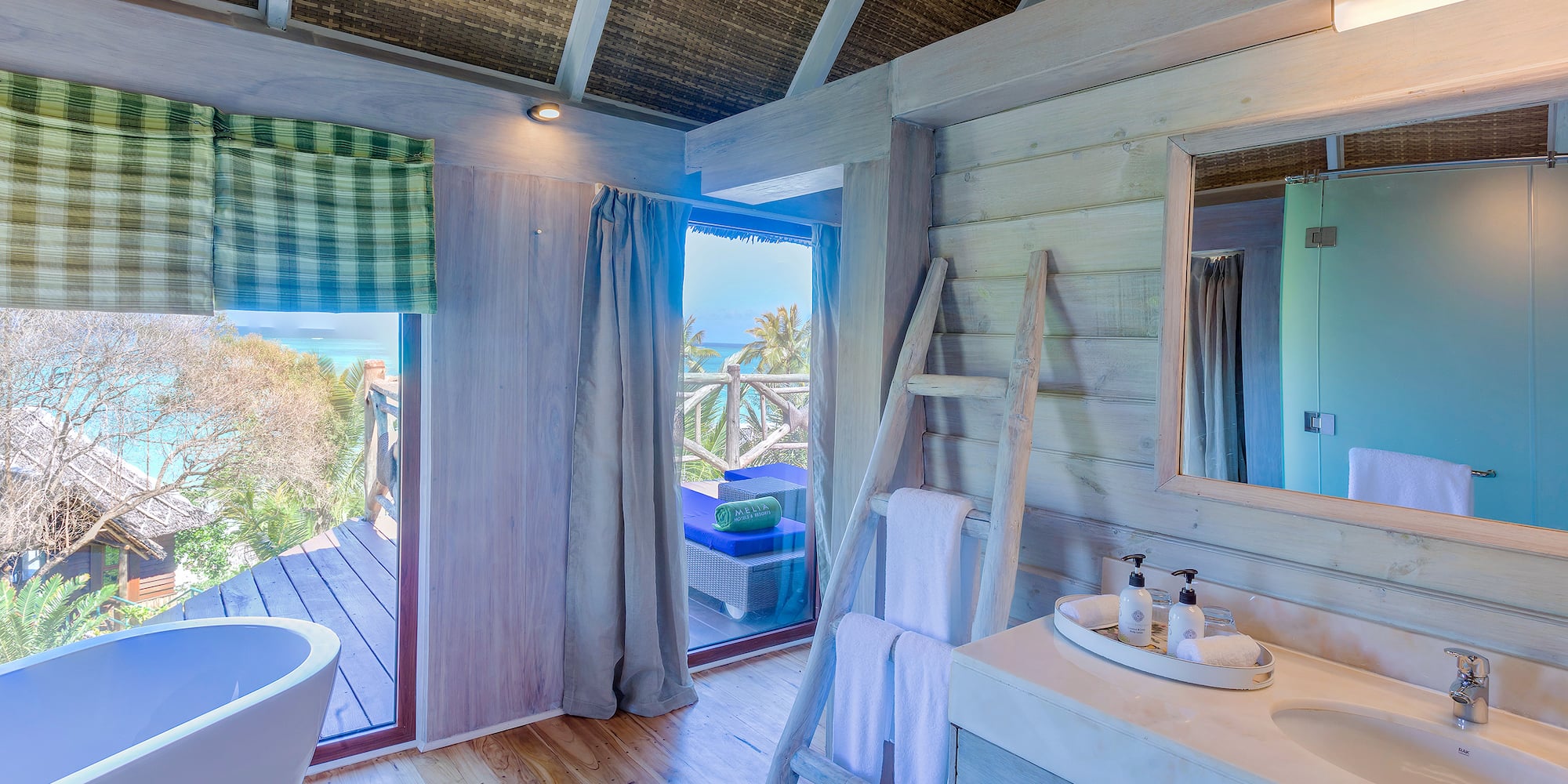 a bathroom with a tub and a sink