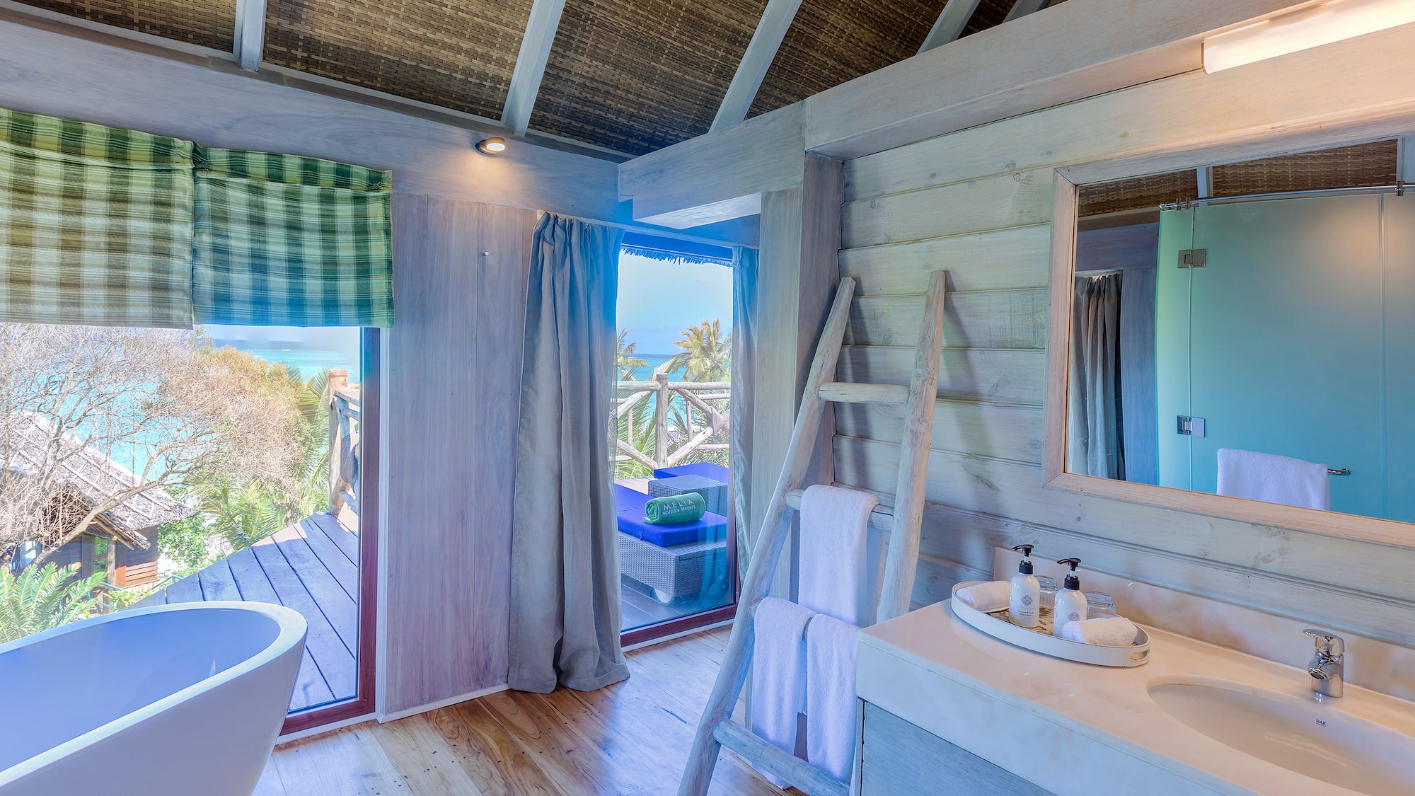 a bathroom with a tub and a sink