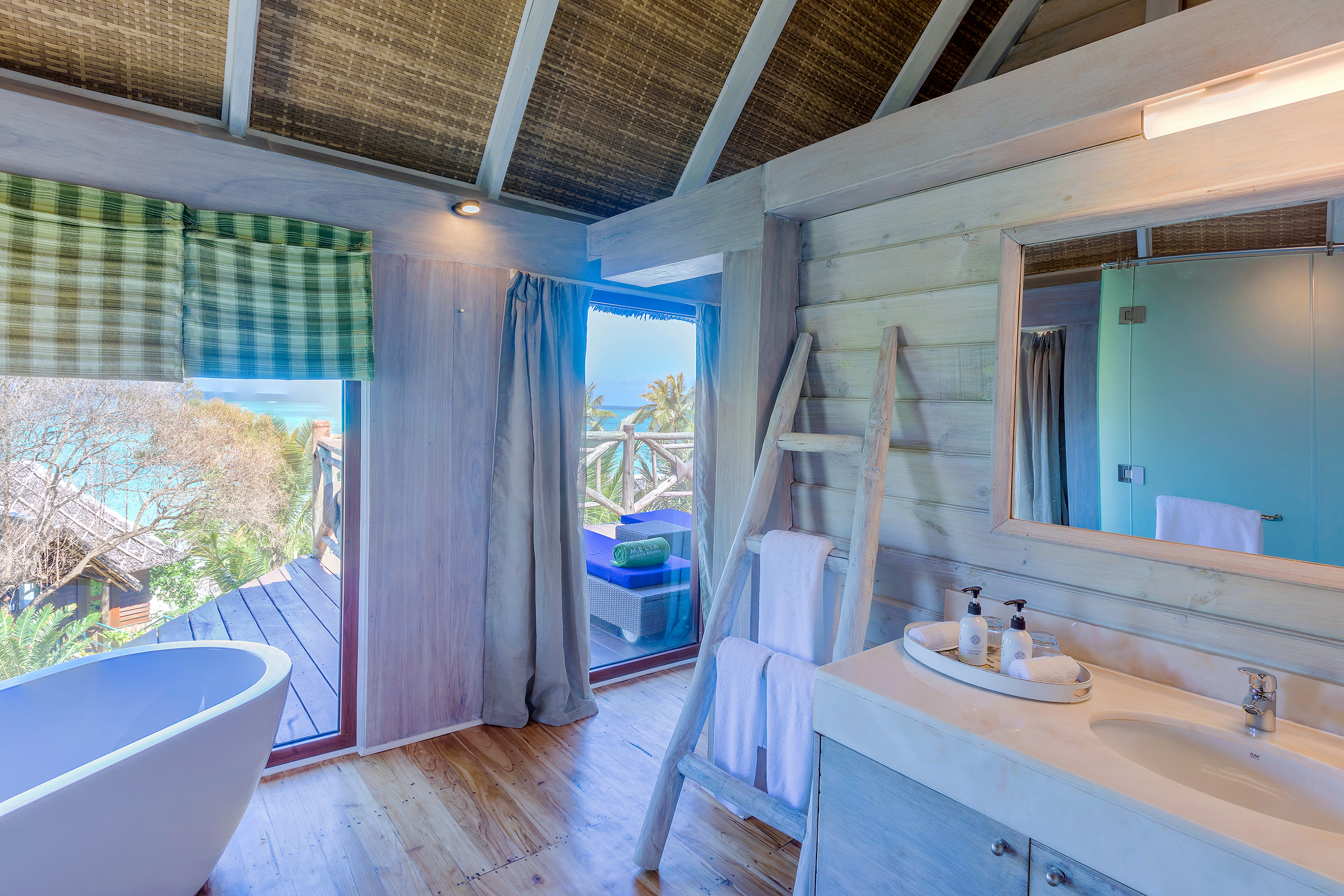 a bathroom with a tub and a sink