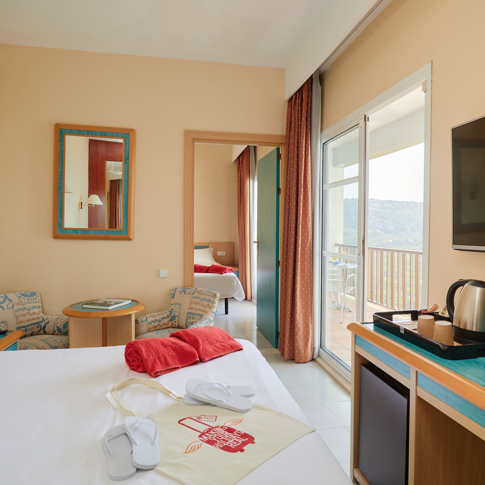 a room with a bed and a television