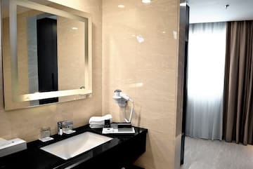 a bathroom with a mirror and sink