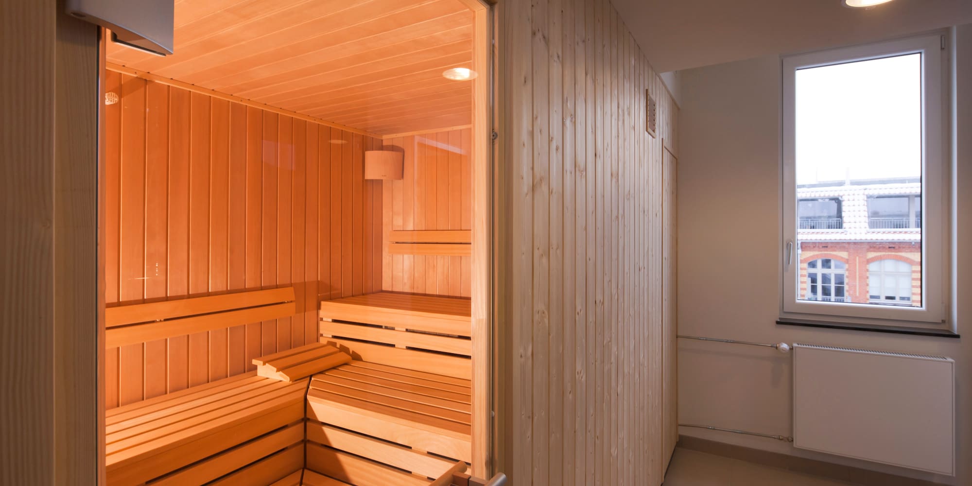 a wooden sauna in a room