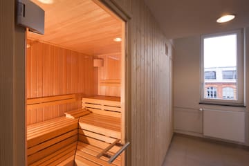 a wooden sauna in a room