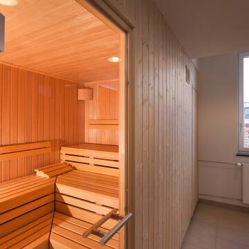 a wooden sauna in a room