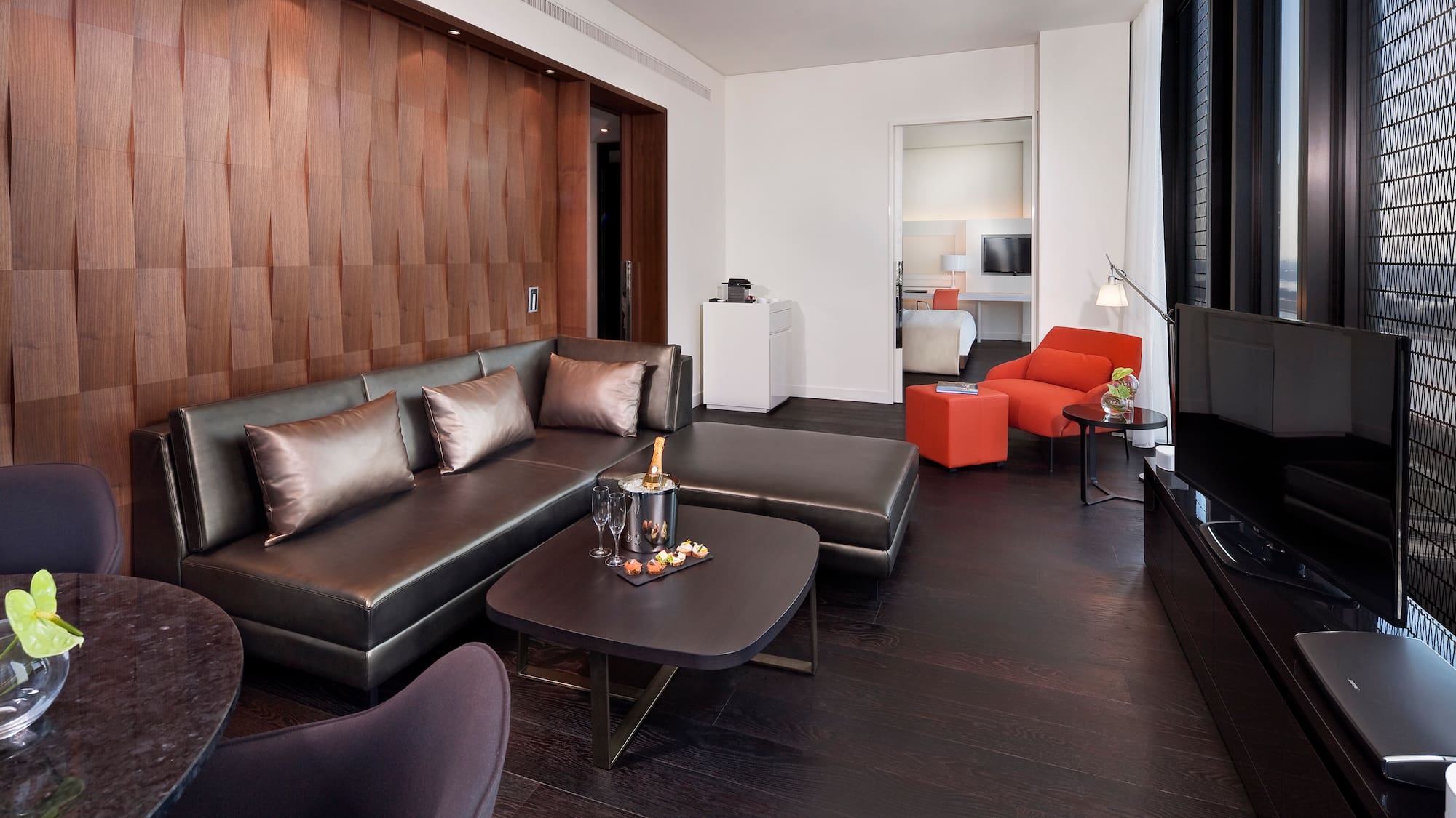 a living room with a couch and a tv