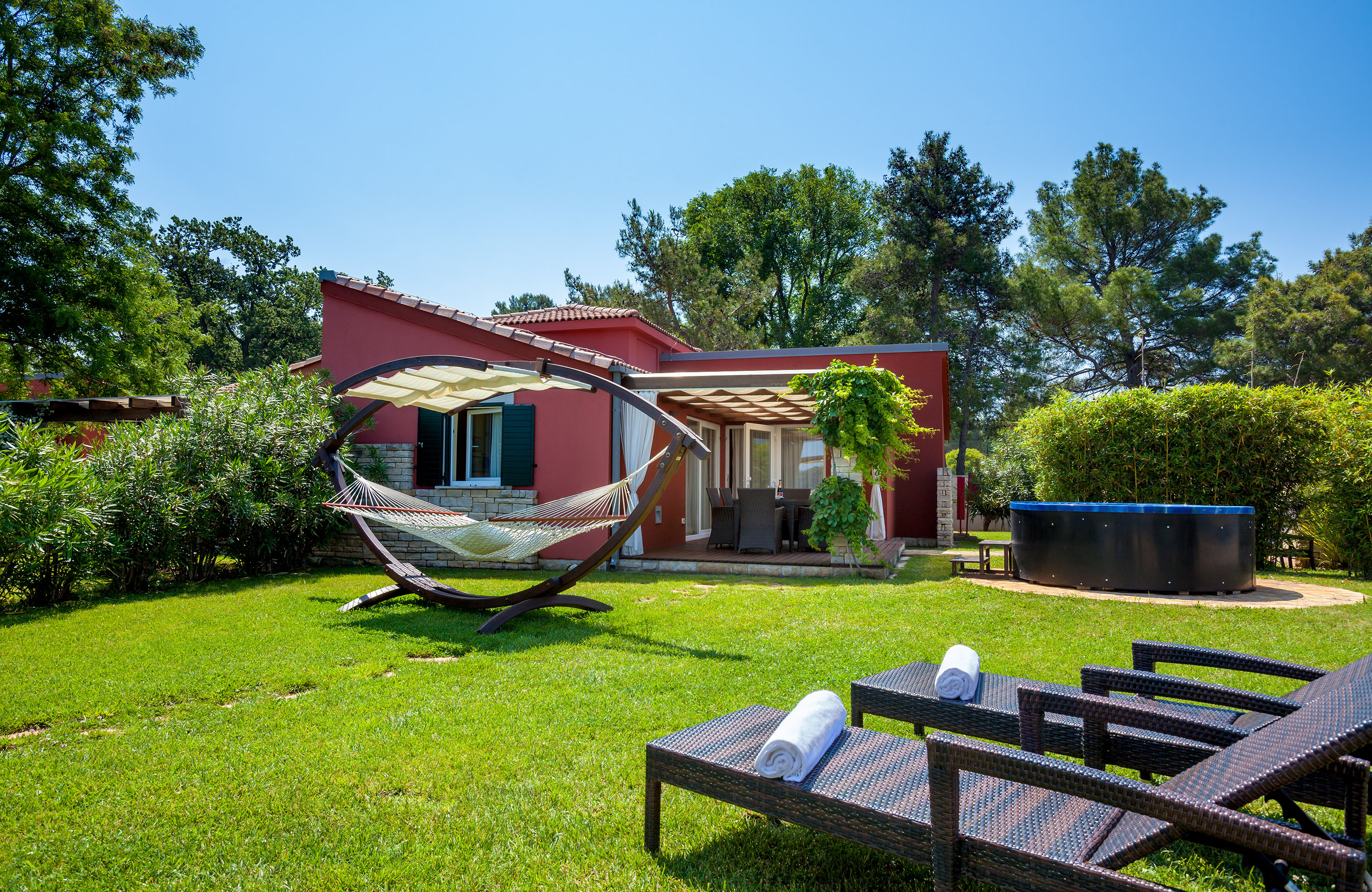 a hammock in a yard of a house