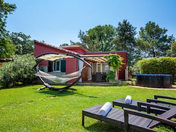 a hammock in a yard of a house