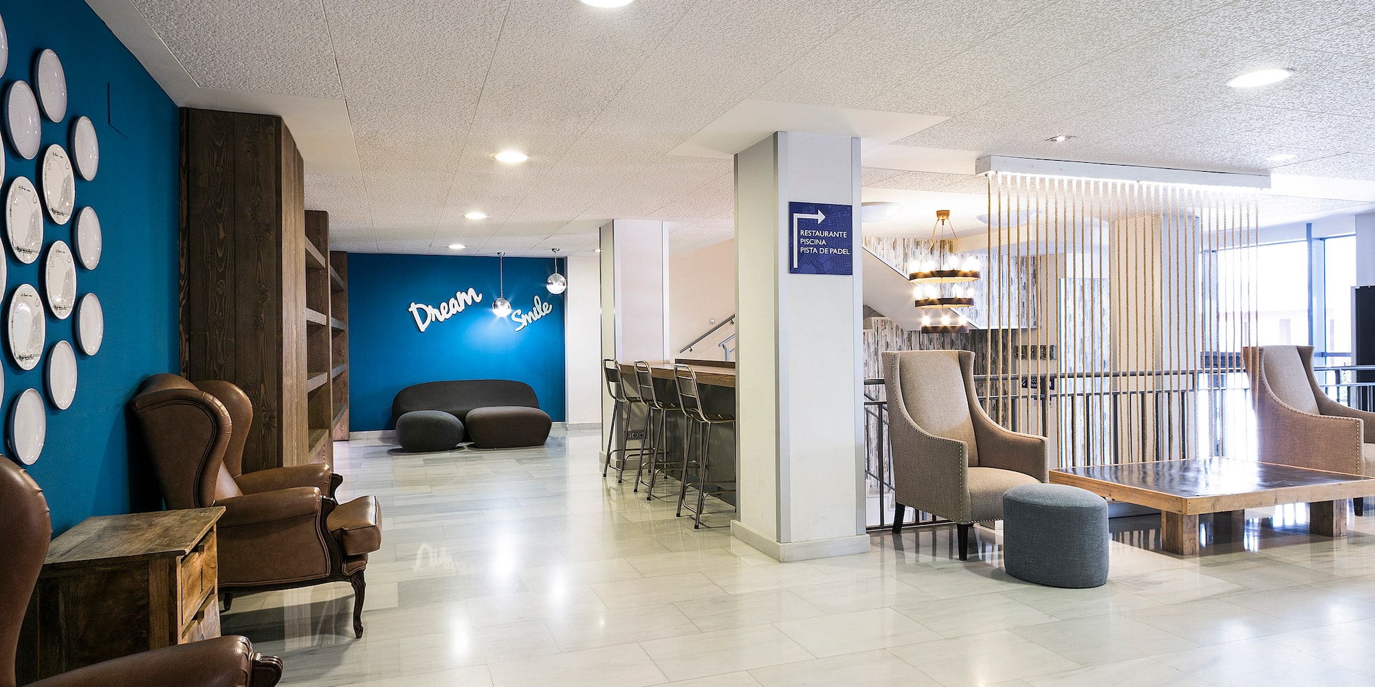 a room with chairs and a blue wall