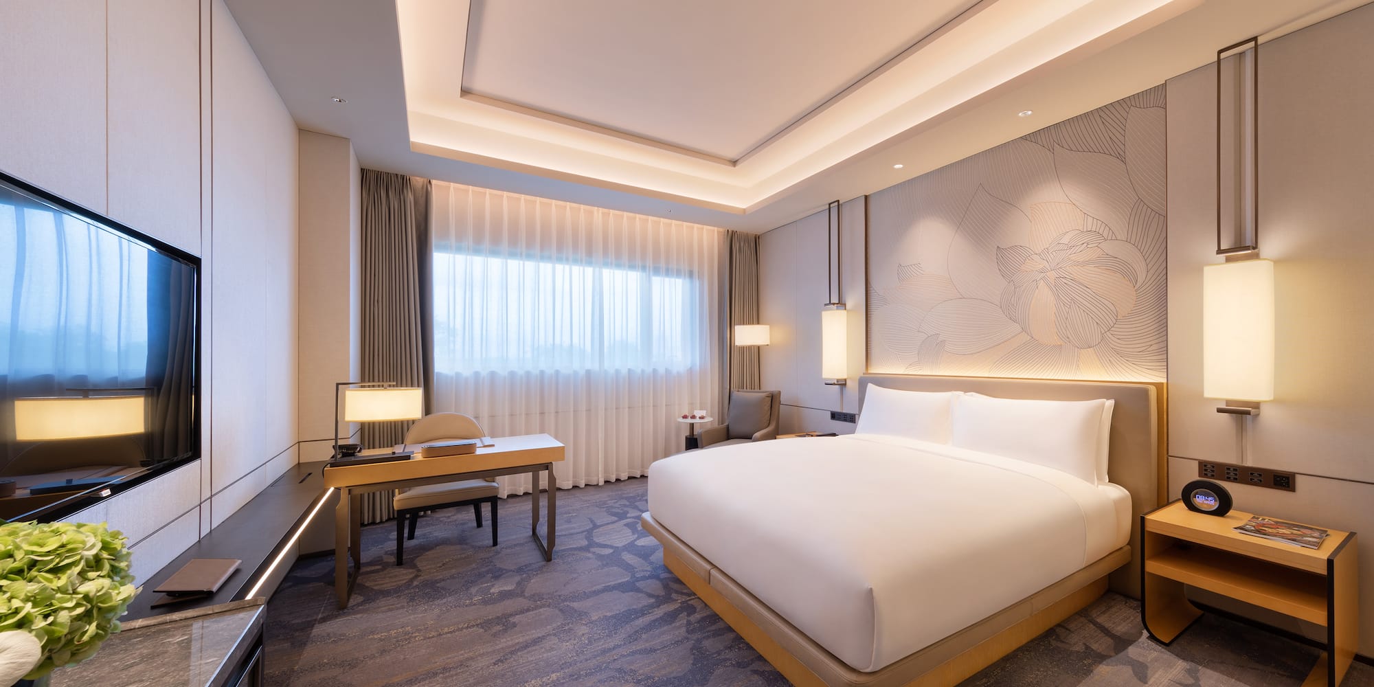 a room with a bed and a desk