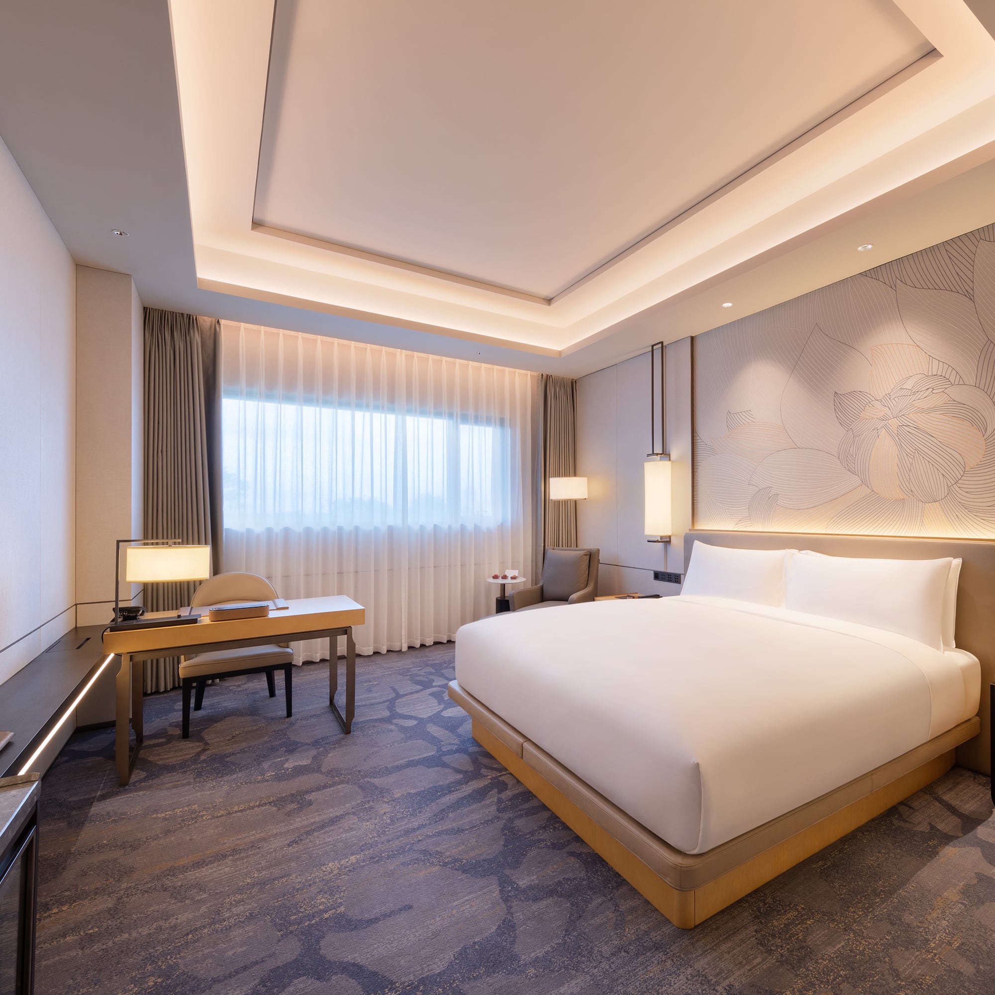 a room with a bed and a desk