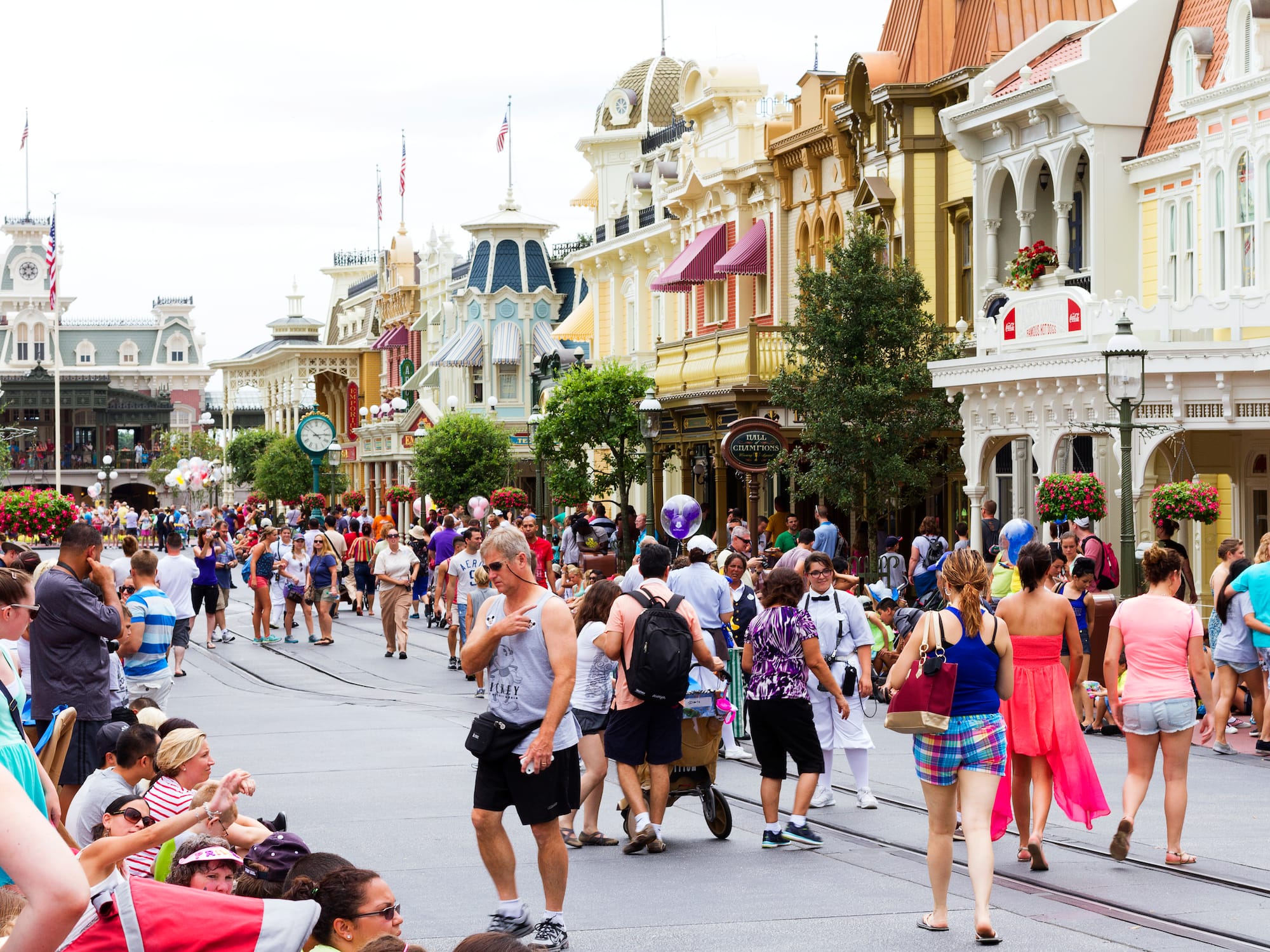 a crowd of people walking on a street