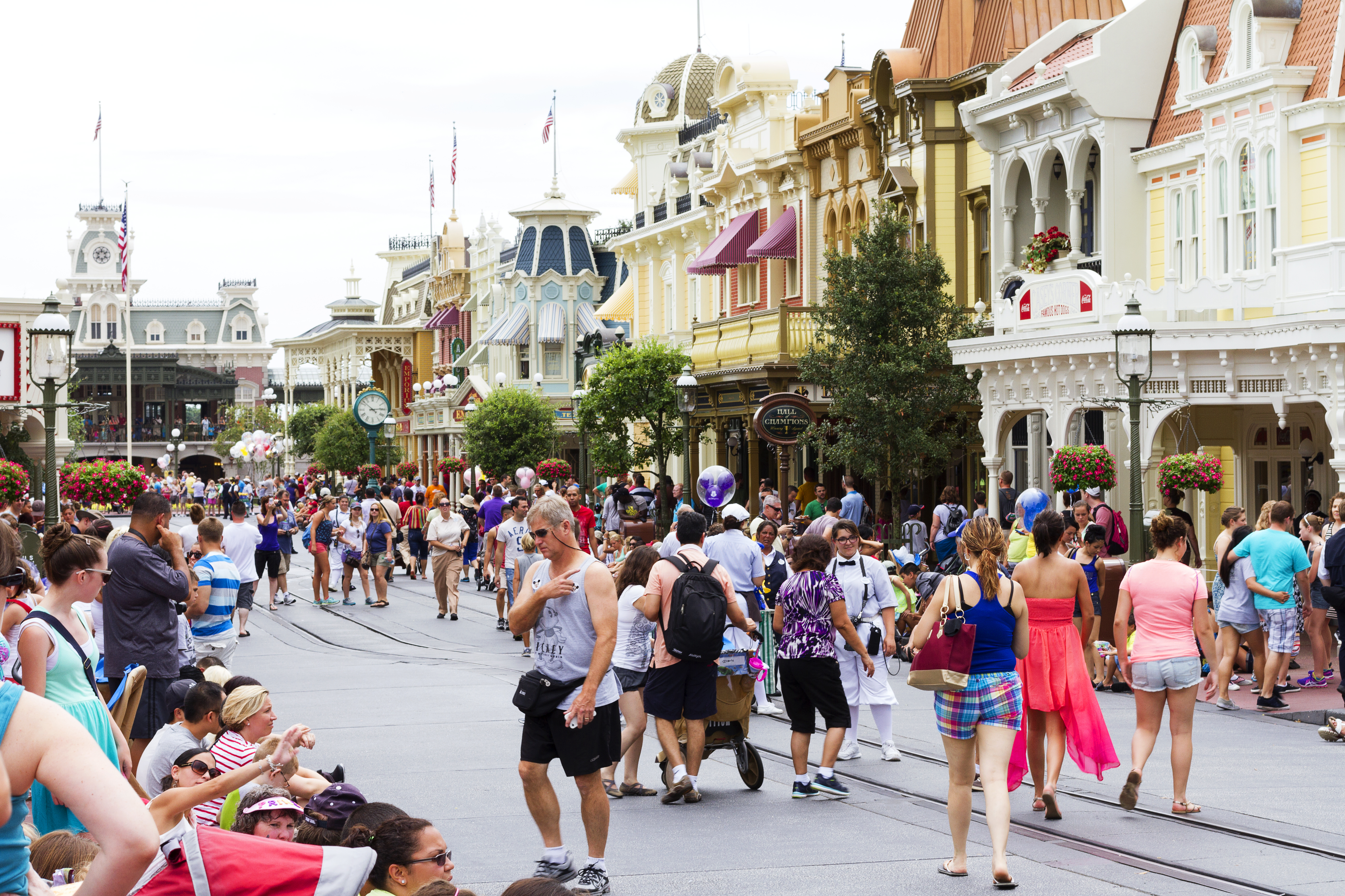 a crowd of people walking on a street
