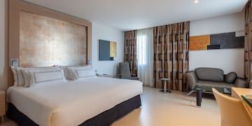 a room with a bed and a chair