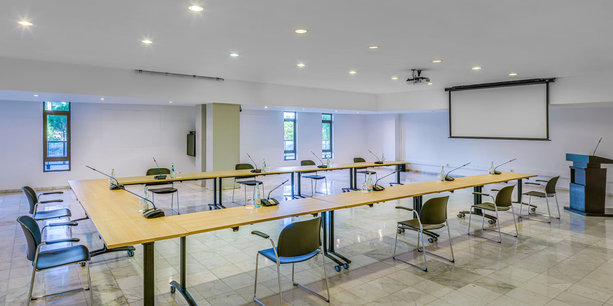 a room with a large table and chairs