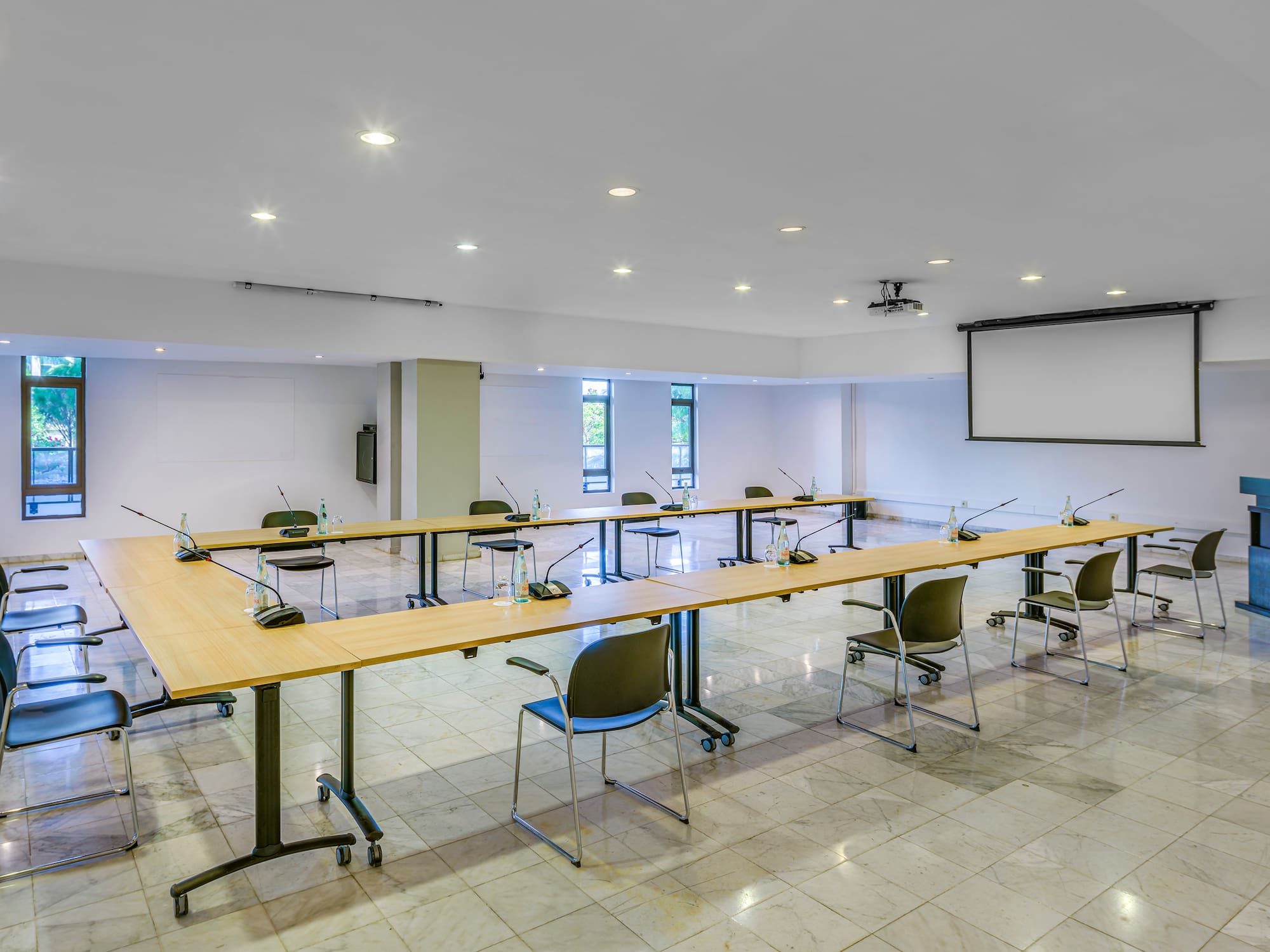 a room with a large table and chairs