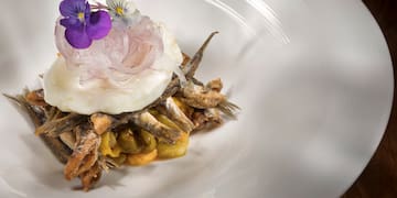 a plate of food with flowers on top