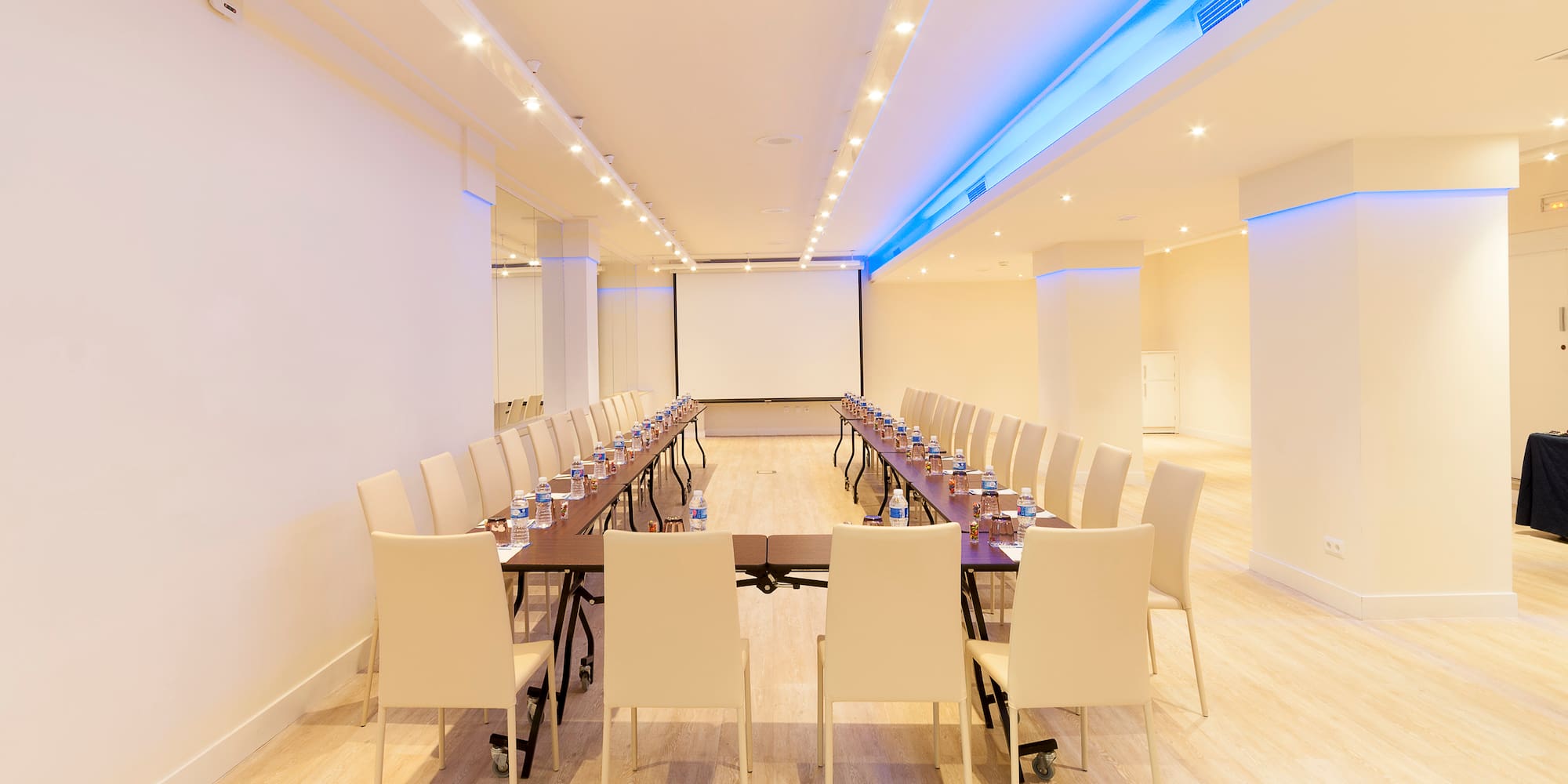 a room with a table and chairs