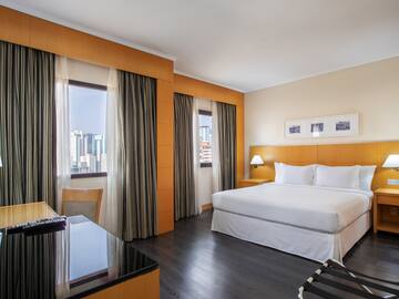 a room with a bed and a desk