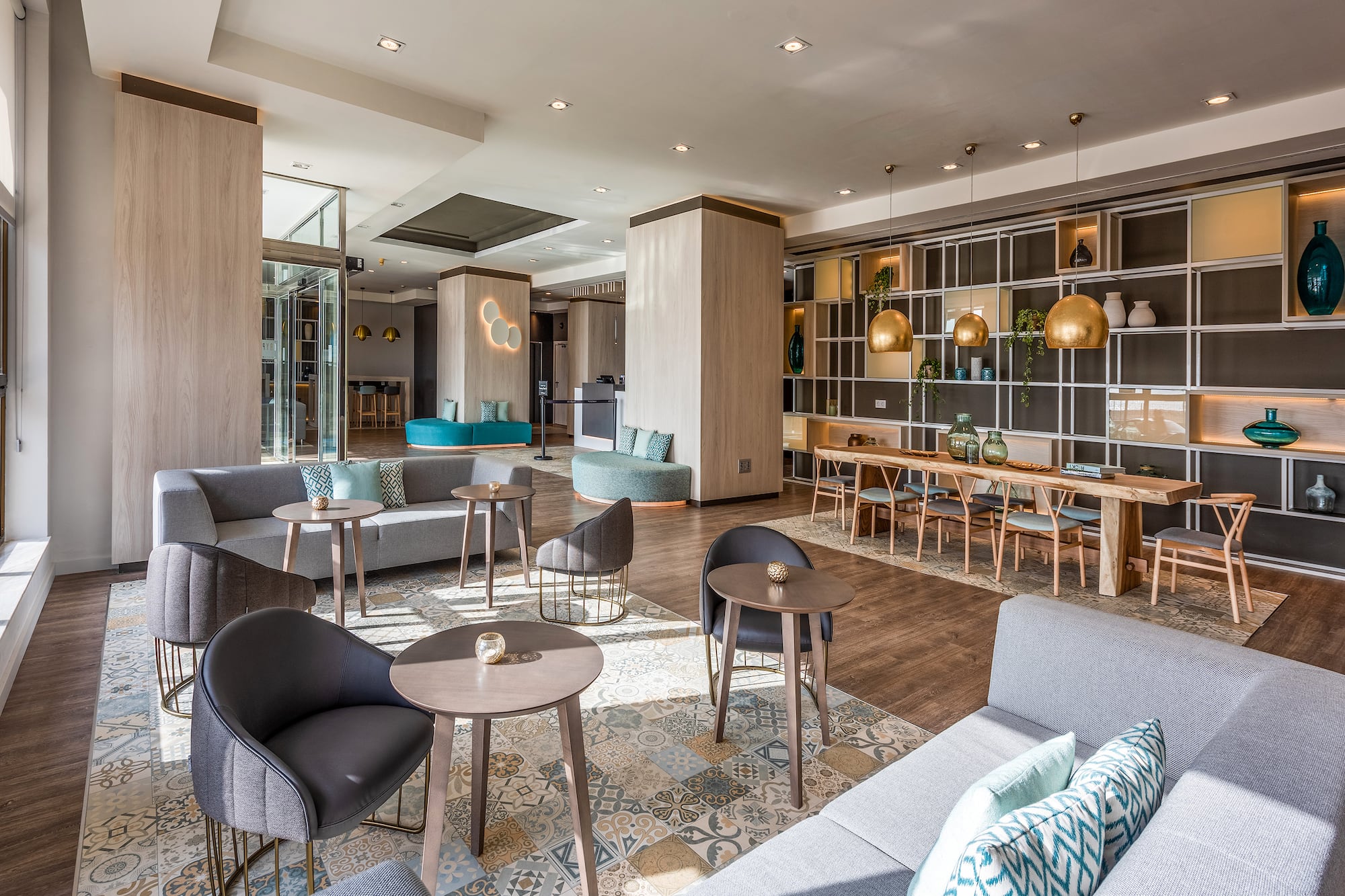Bright, spacious hotel lobby featuring comfortable seating and modern decor.