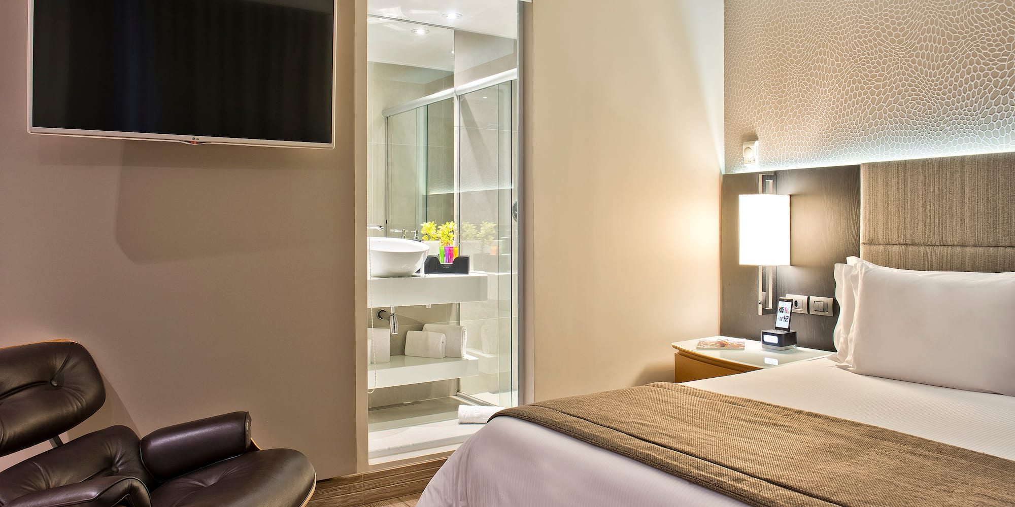 a bedroom with a tv and a bed