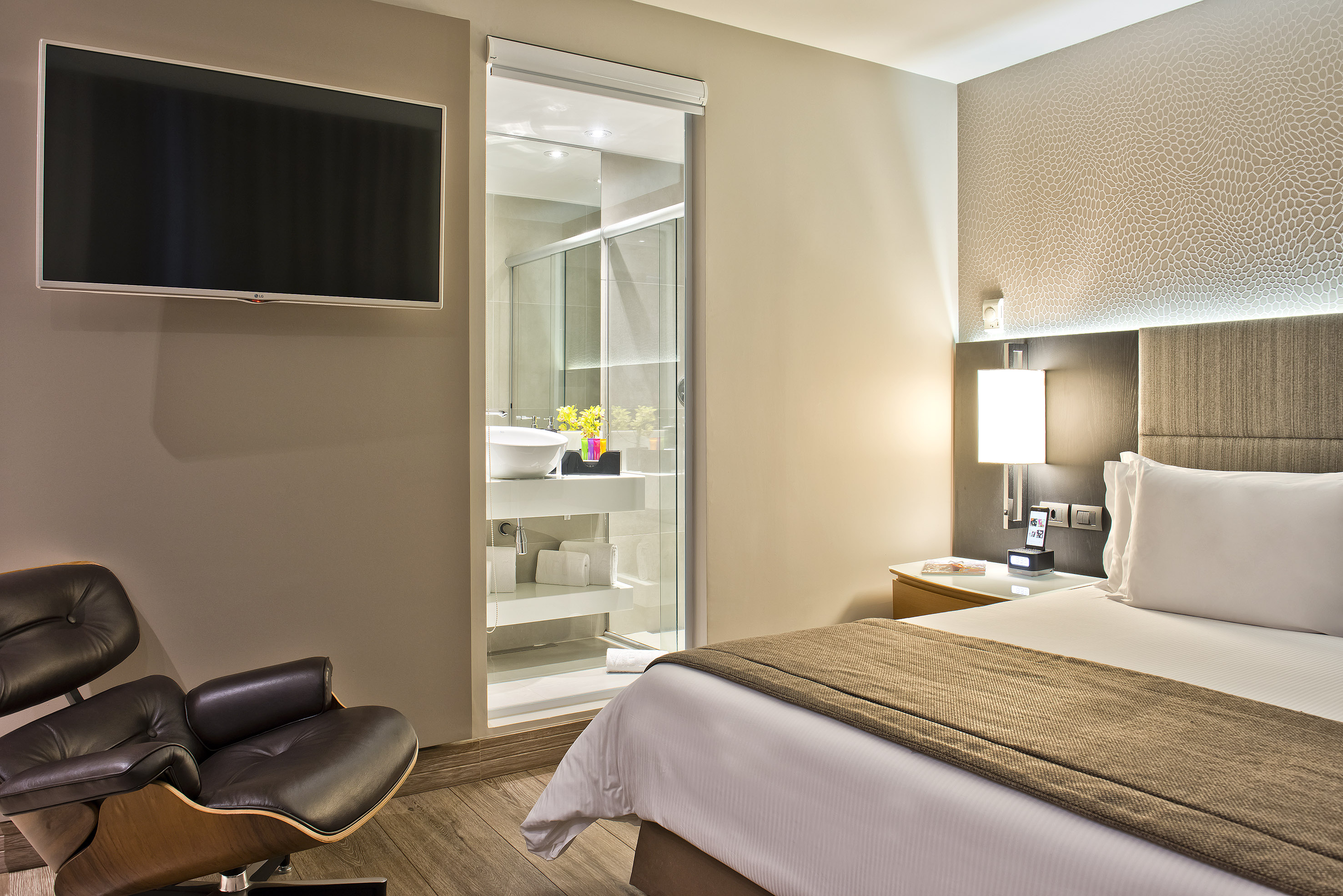 a bedroom with a tv and a bed