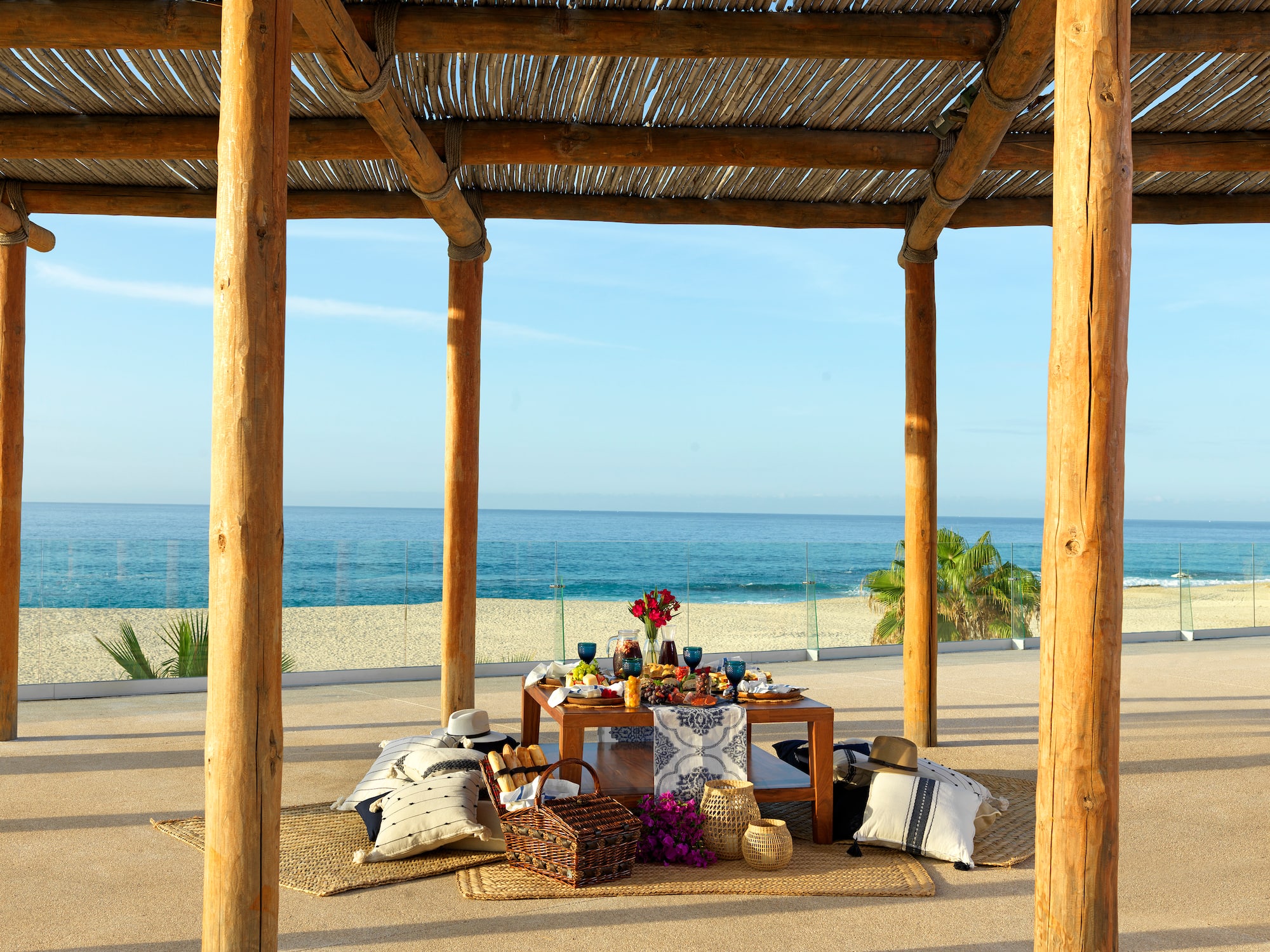 a table with food on it under a wooden structure