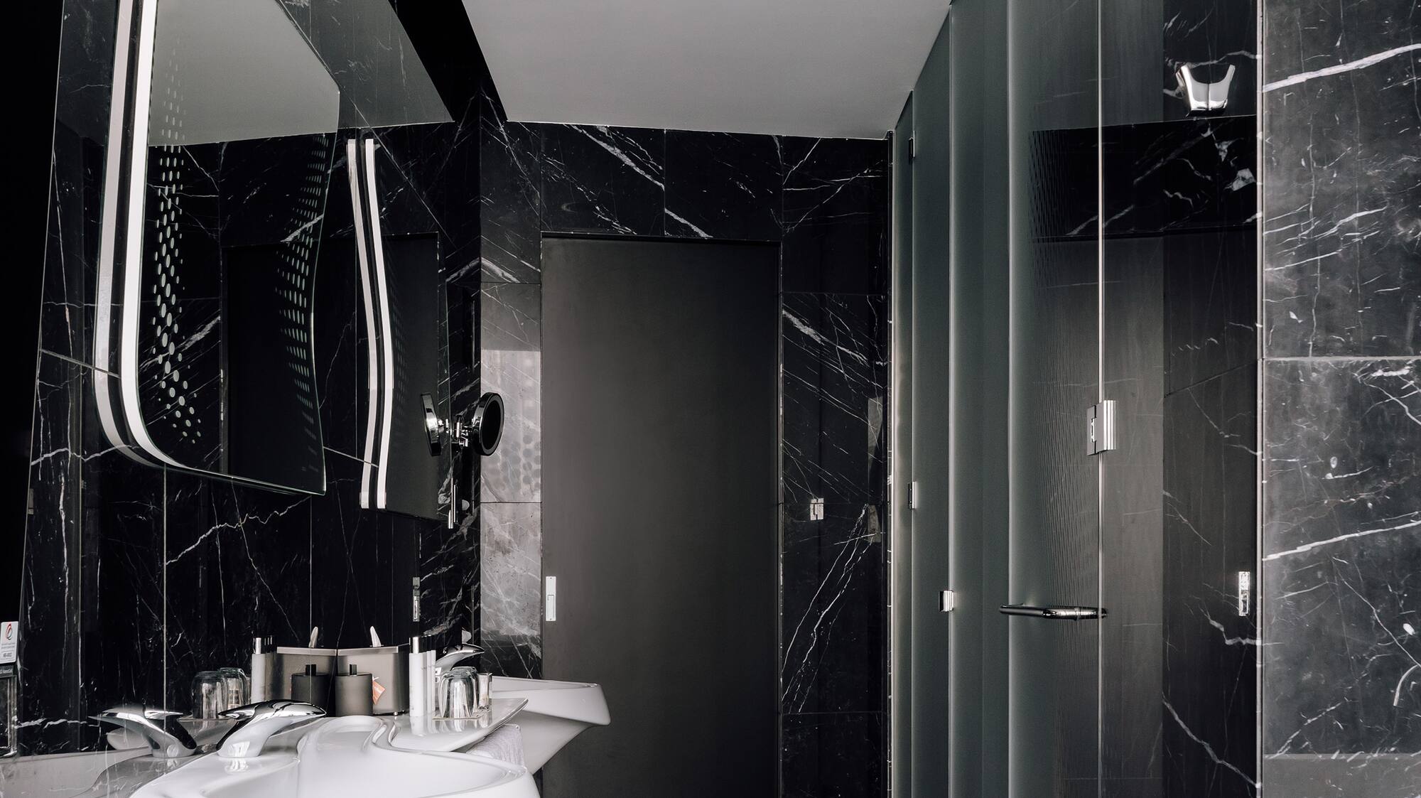 a bathroom with a sink and mirror