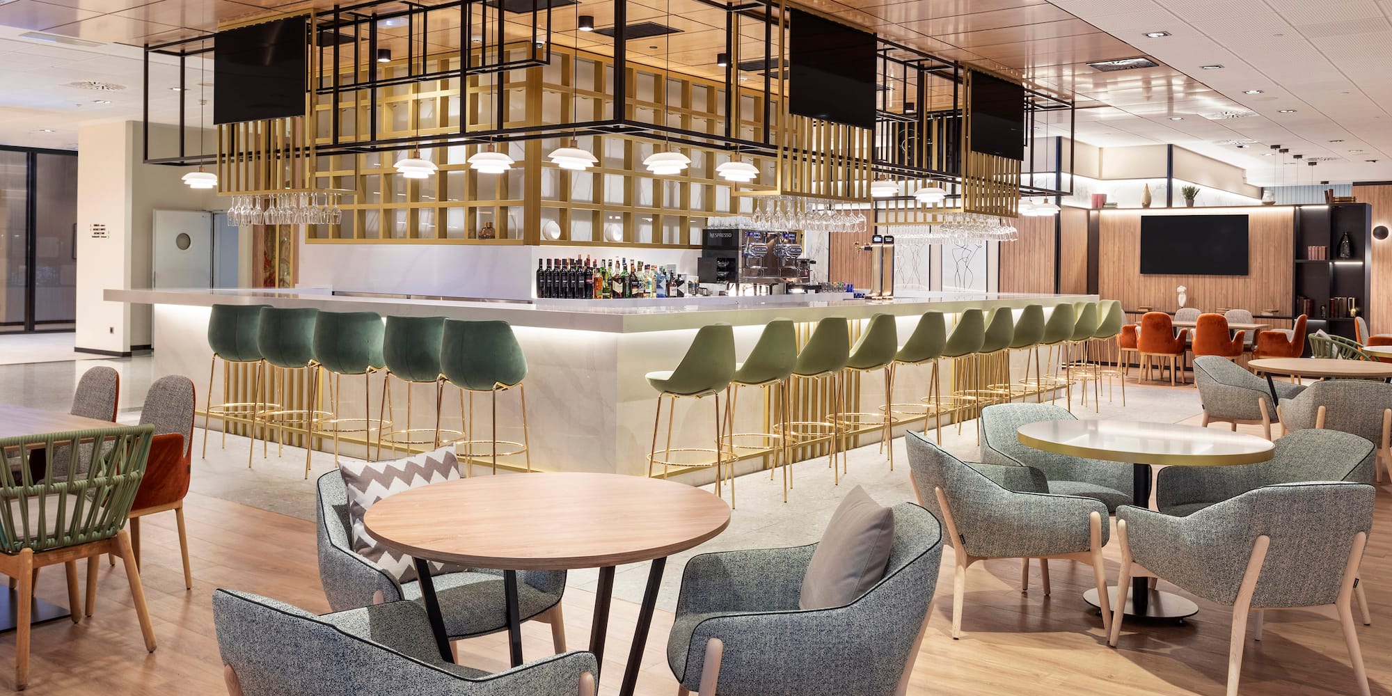 a room with a bar and chairs